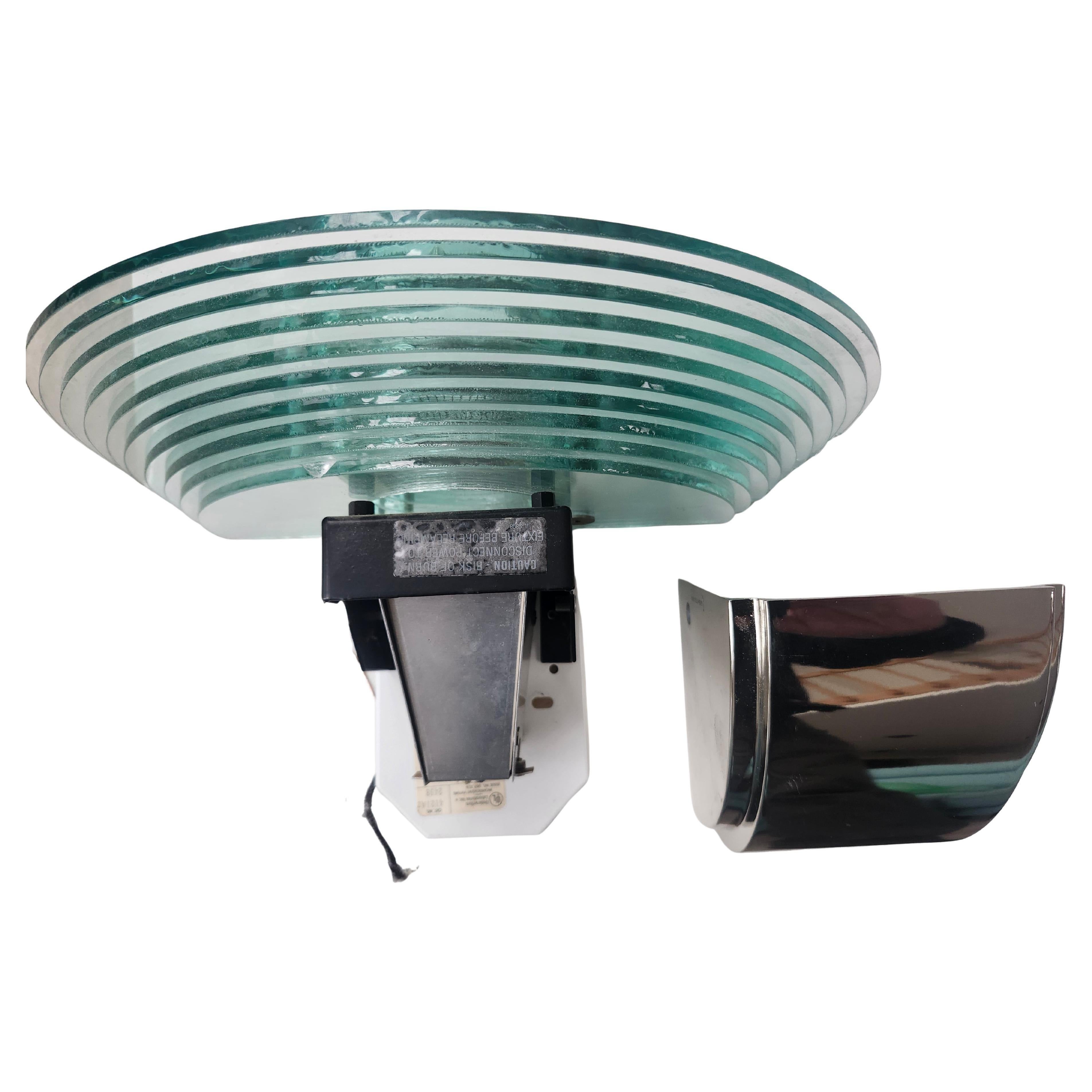 Fabulous pair of high quality wall sconces by Lightolier.  Multiple staggered and stacked rounded glass panels with a chromed housing. Very elegant! Pair is in near perfect condition with a flea bite chip on one bottom glass panel, see pics or the