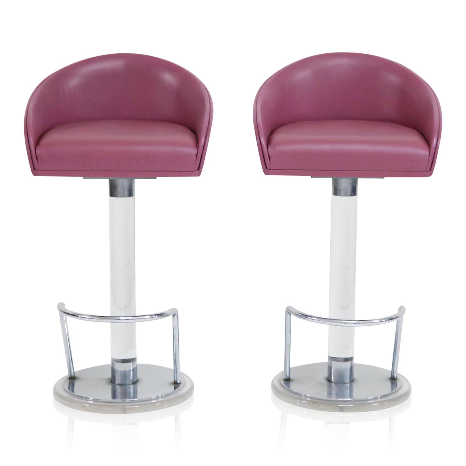 This gorgeous pair of lucite, leather and chrome swiveling barstools by Lion in Frost, circa 1970s, are signed on the lucite post, near the base and are in excellent condition with gorgeous deep Lilac colored leather, which can be described as a