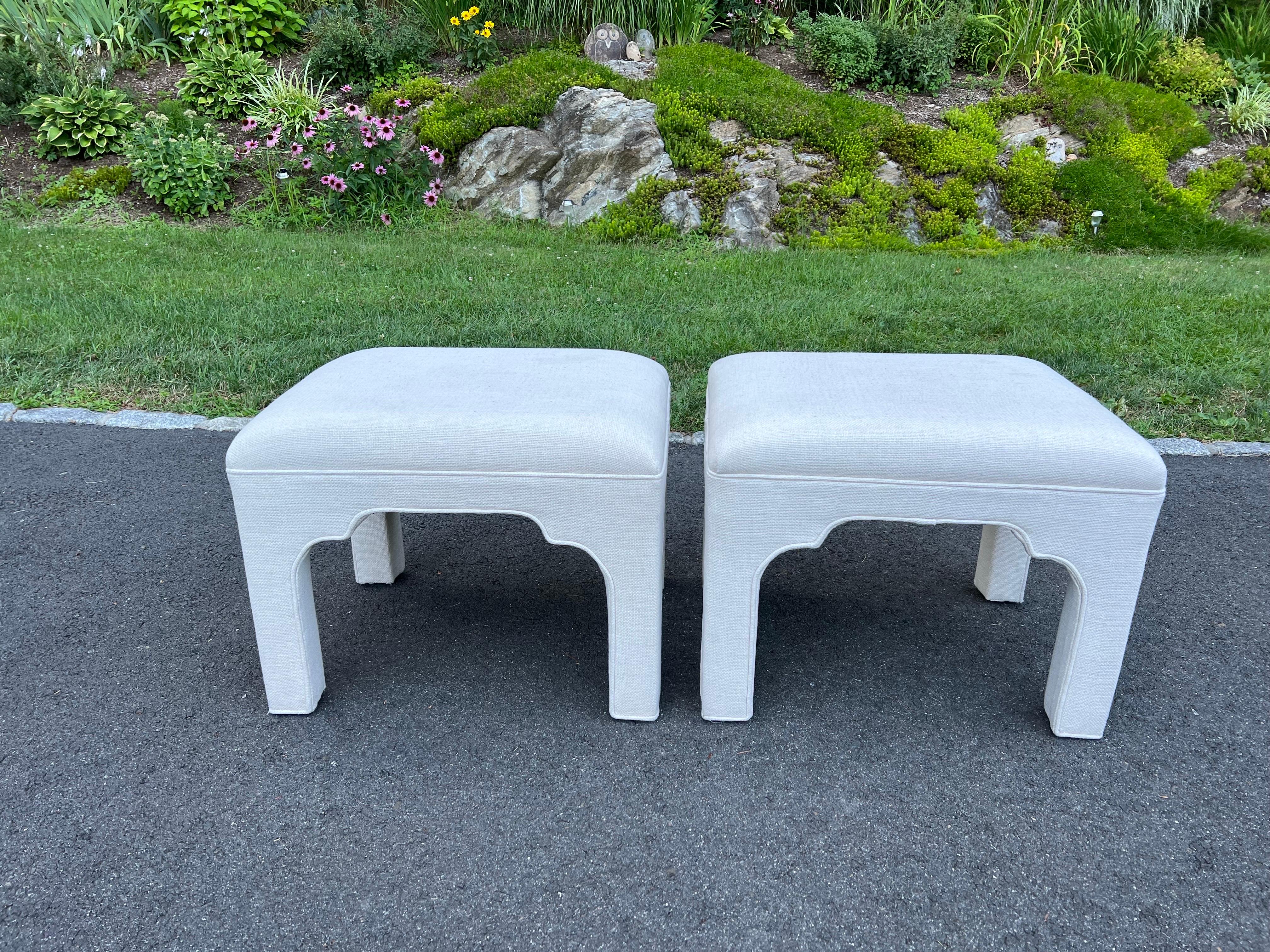 Pair of Lillian August Linen Ottomans. Classic tailored pair with a Moroccan vibe. Oversized and very sturdy. Some small superficial spots but otherwise in excellent shape. Use as is or recover if you want.