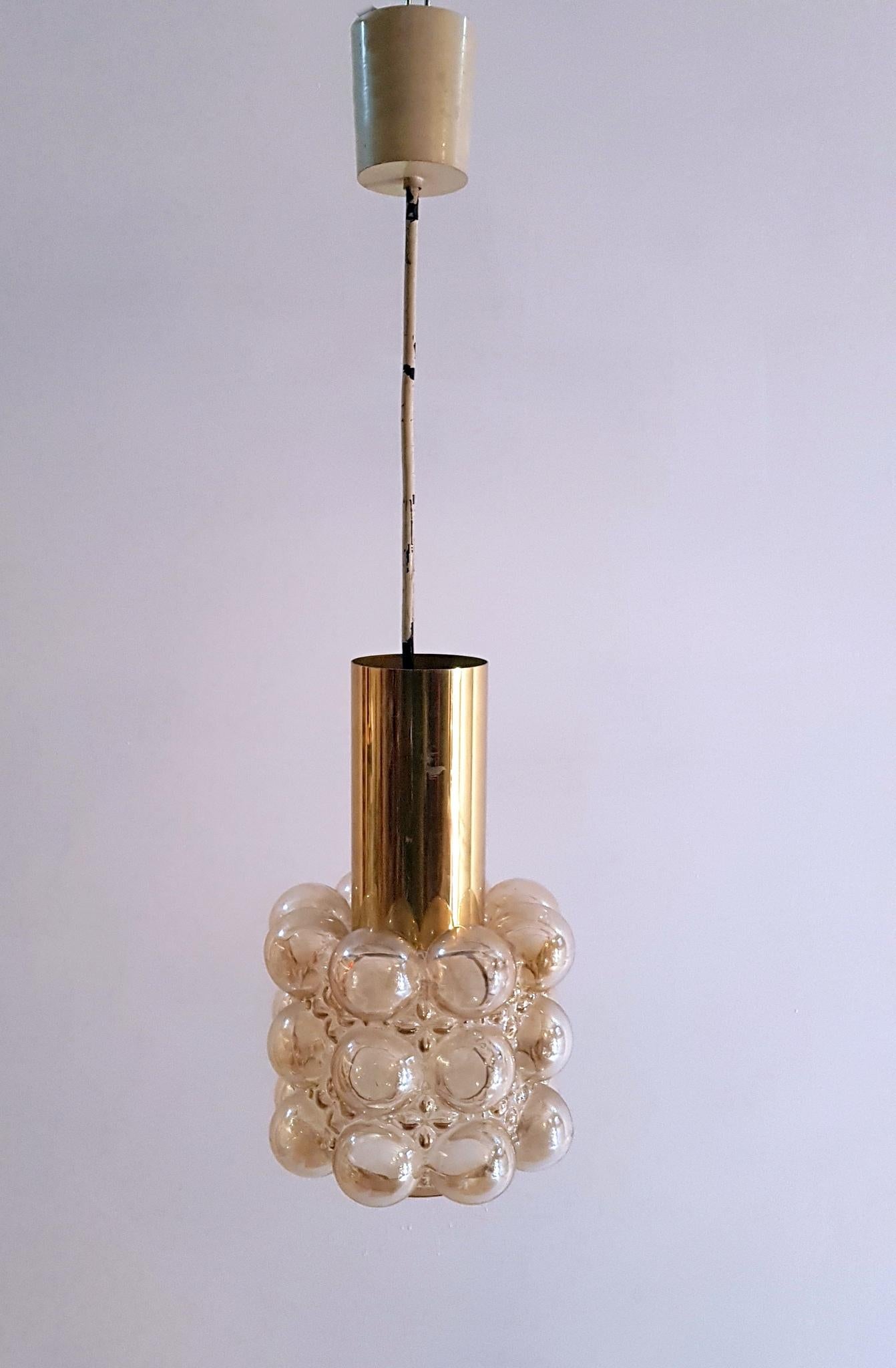 Classic glass bubble pendant lamp from the 1960s manufactured by Limburg and designed by Helena Tynell.
Very good vintage condition with little signs of wear and fully functional. Has the original cord in the pictures but will be changed unless