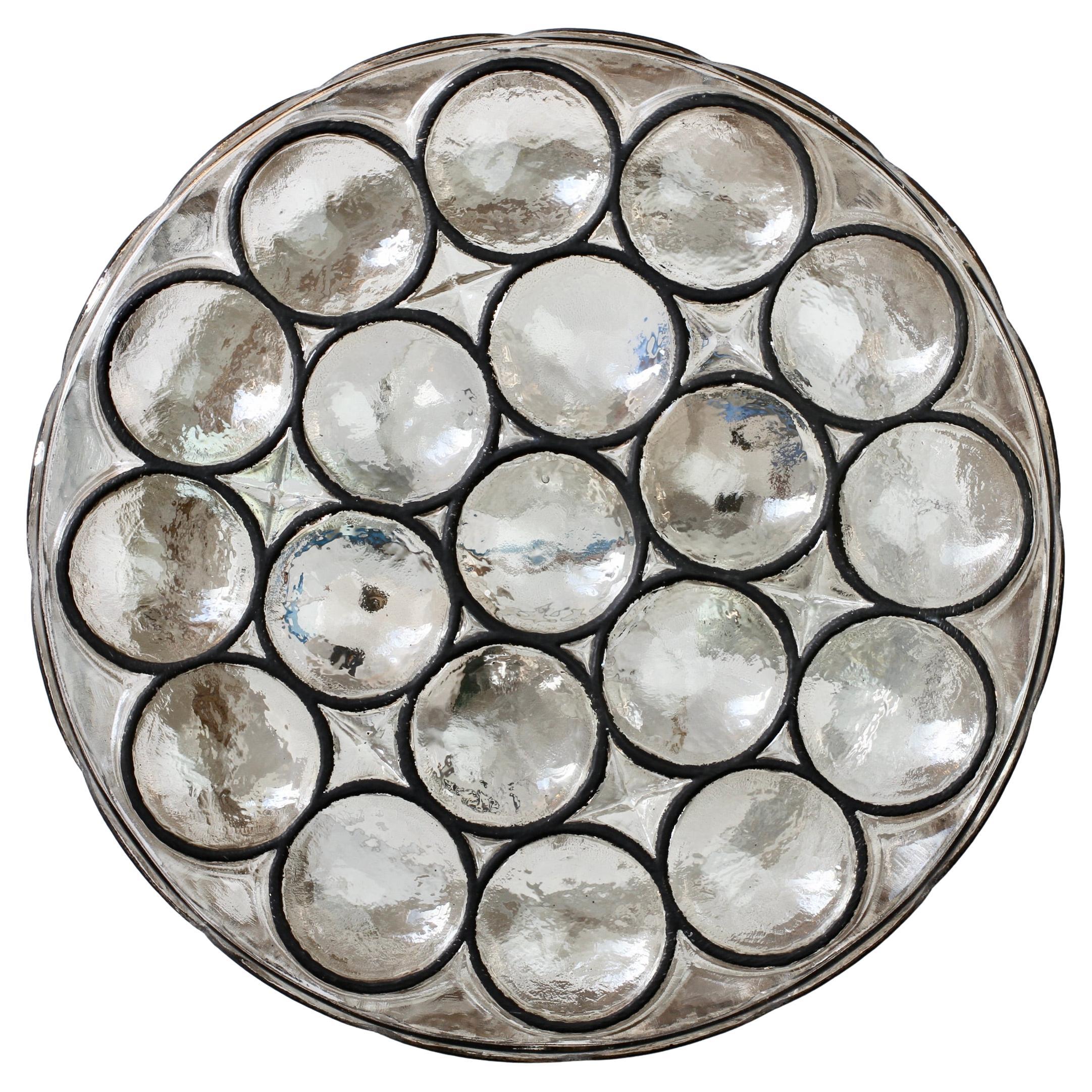 Rare pair of Mid-Century Modern vintage Glashütte Limburg, large double socketed circular iron and glass flush mount lights / sconces made in Germany, circa 1965. Featuring thick, heavy blown glass with concave round 