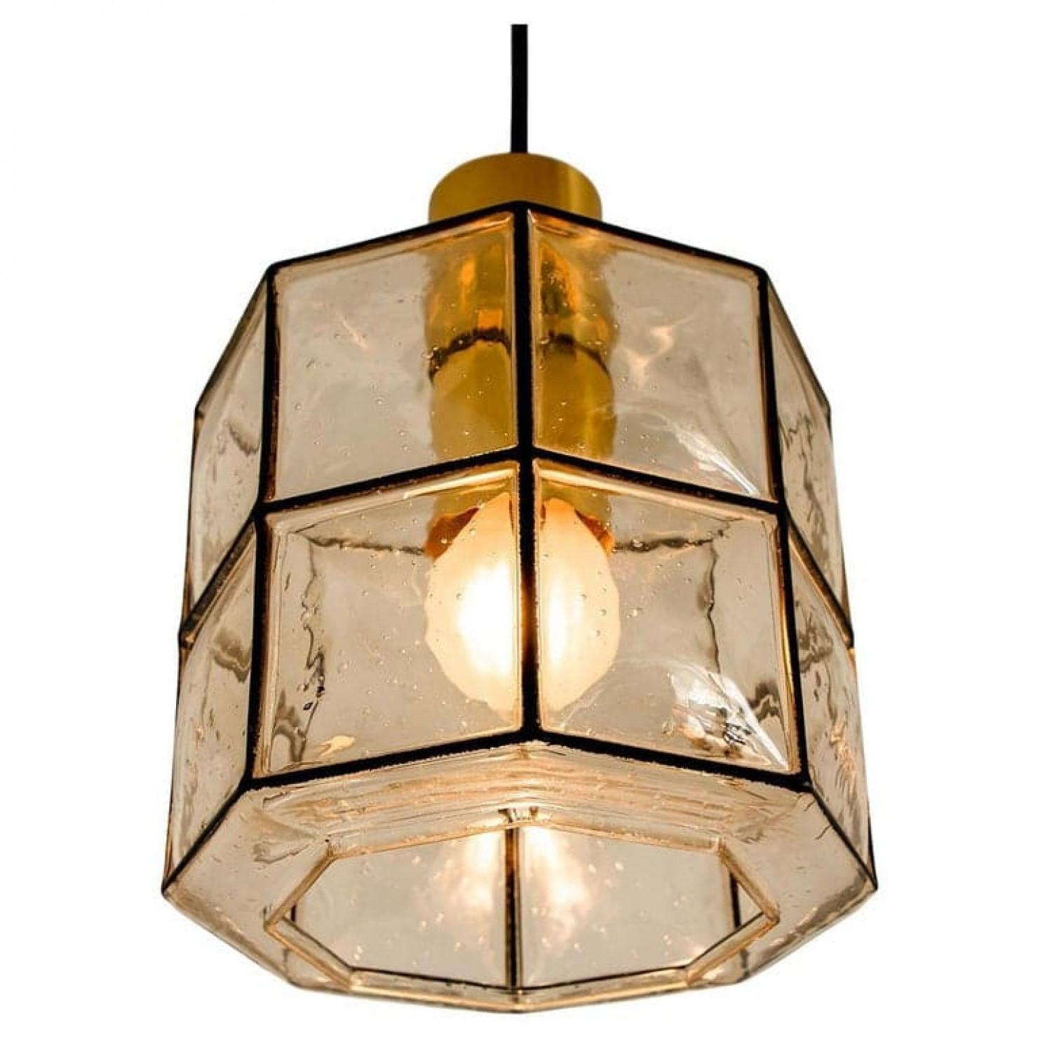Pair of pendant lamps by Glashütte Limburg, Germany. Topaz (gold brown) tone. Bubble glass with a polished brass fixture. Beautiful craftsmanshi of the 20th century.

Heavy quality and in perfect condition. Cleaned, well-wired and ready to use

We