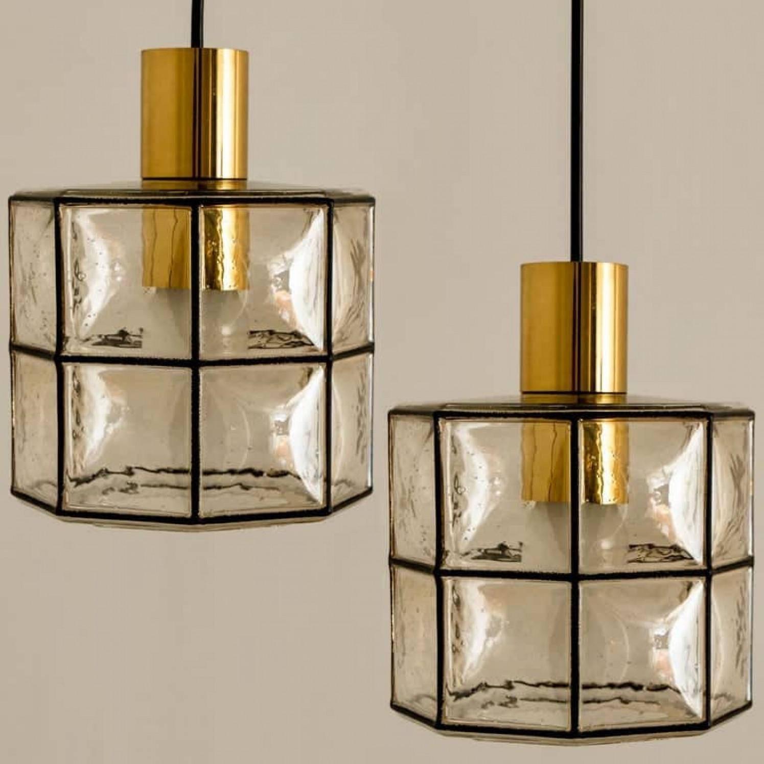 Mid-Century Modern Pair of Limburg Pendant Lights, Brass and Topaz Iron Glass, 1960 For Sale