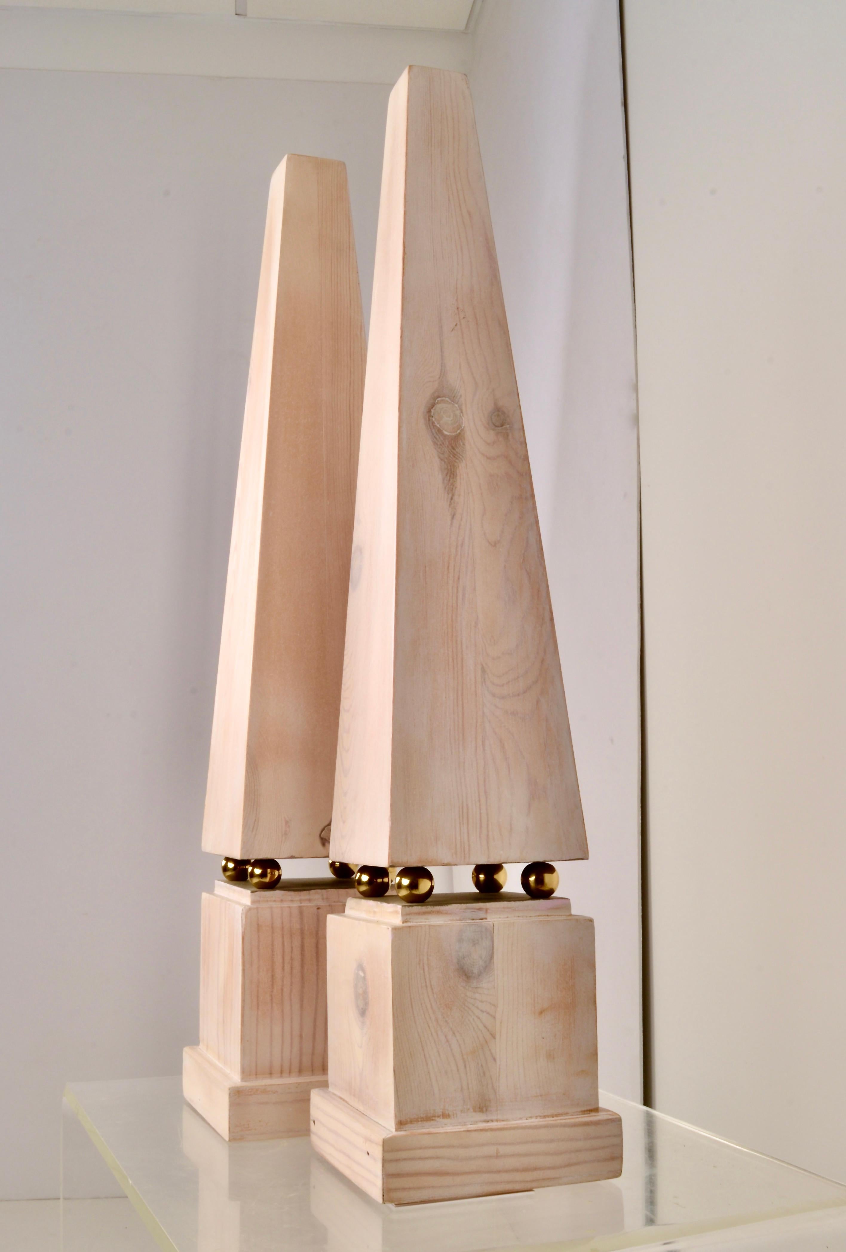 Handsome pair of wooden obelisks in white washed finish. Nice large size at almost 30 inches. Solid brass ball details.