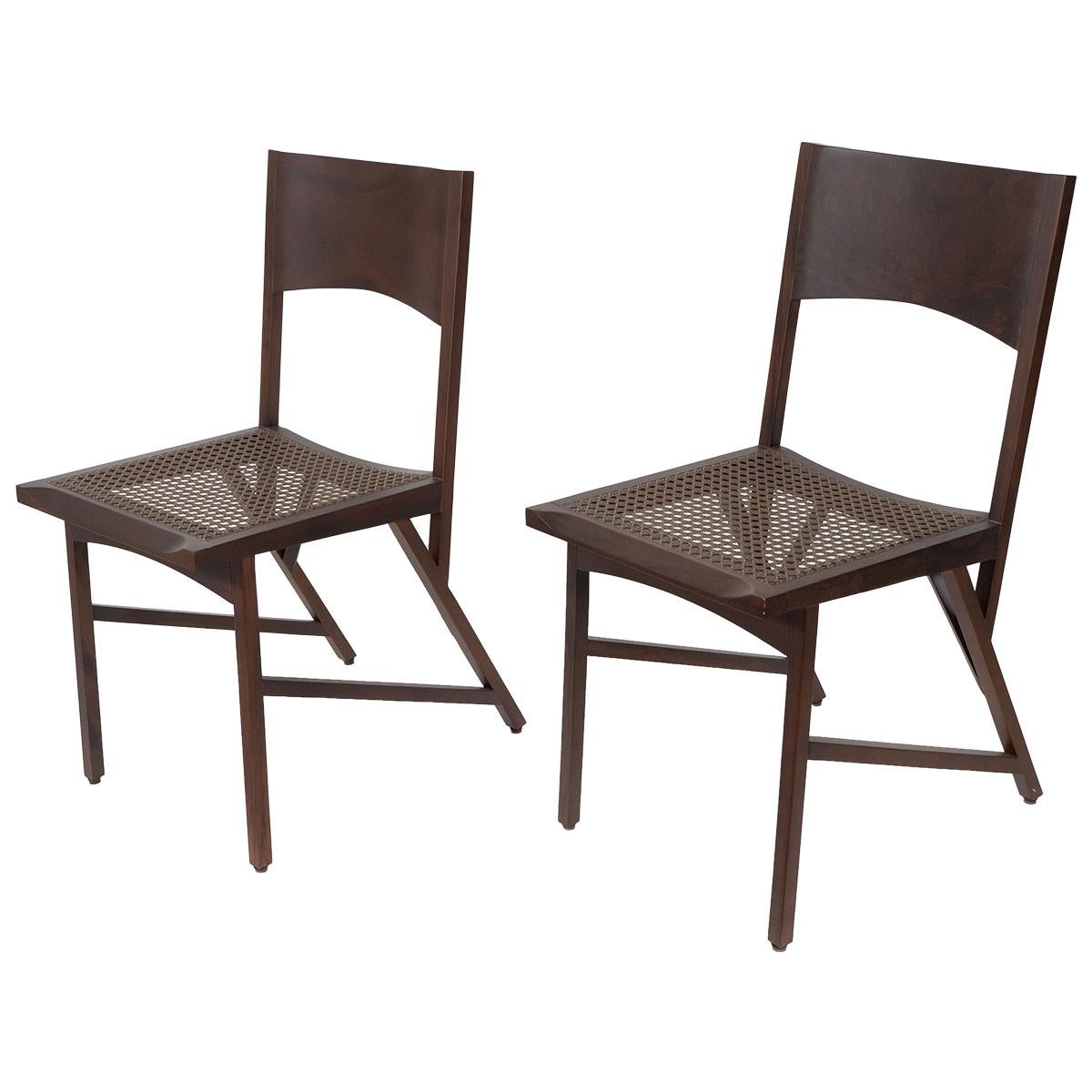 Pair of limited edition wicker and rare Brazilian wood chairs by Paolo Alves.
