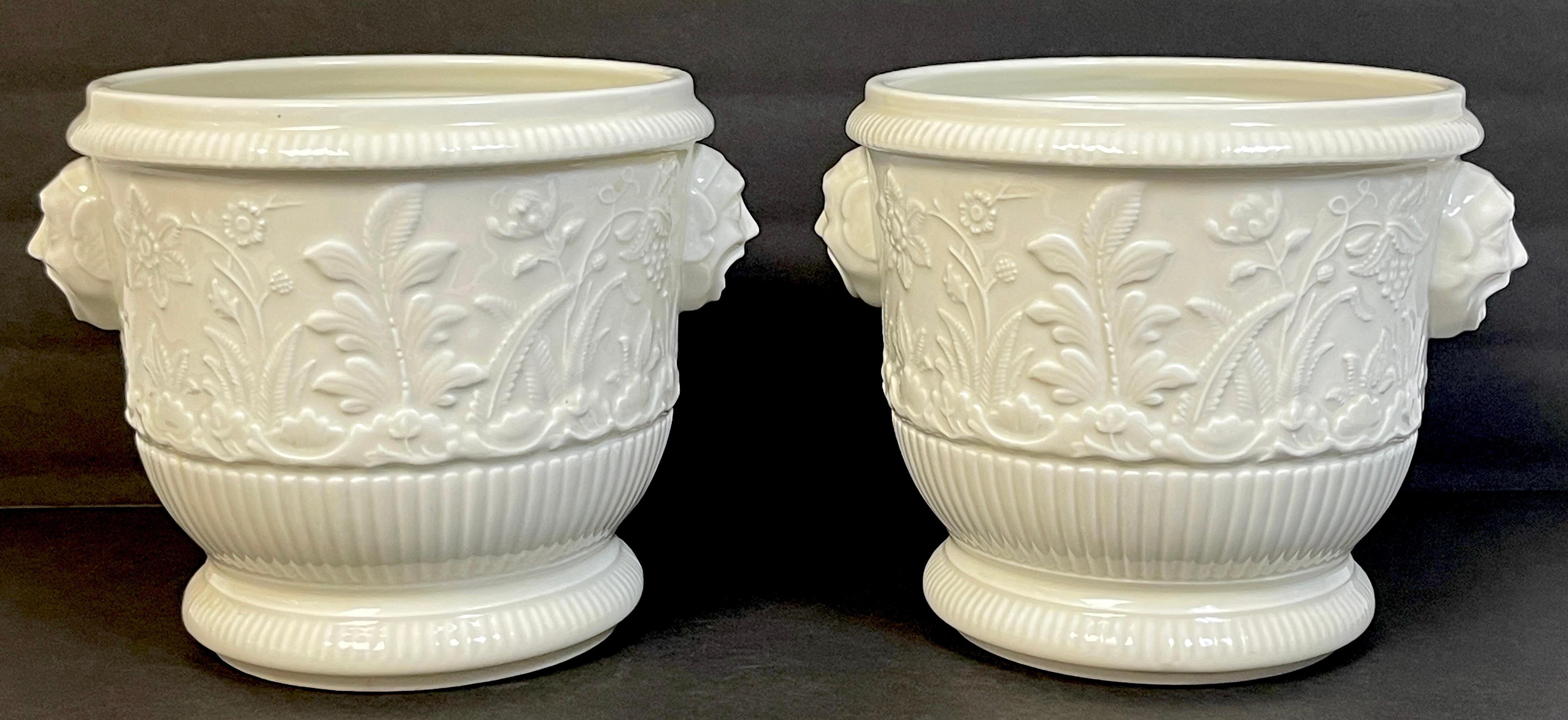 Pair of Limoges 'St Cloud 1725-40' Blanc de Chine Cachepot/Wine Coolers
France, Circa 1980s

Made expressly for the MMA- Metropolitan Museum of Art
Each one fully marked in black ' Reproduction is of Soft Paste Porcelain Seau a Bouteille or Wine