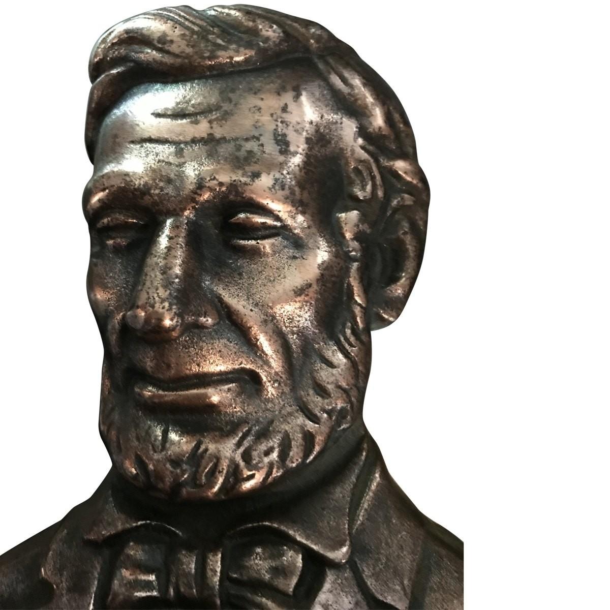 Pair of  Vintage design  unique  This presidential pair of bookends is the one and only Abraham Lincoln. This carved bust-style set is created in copper-toned cast iron. This set will add a quirky, yet stately touch to any book collection.

