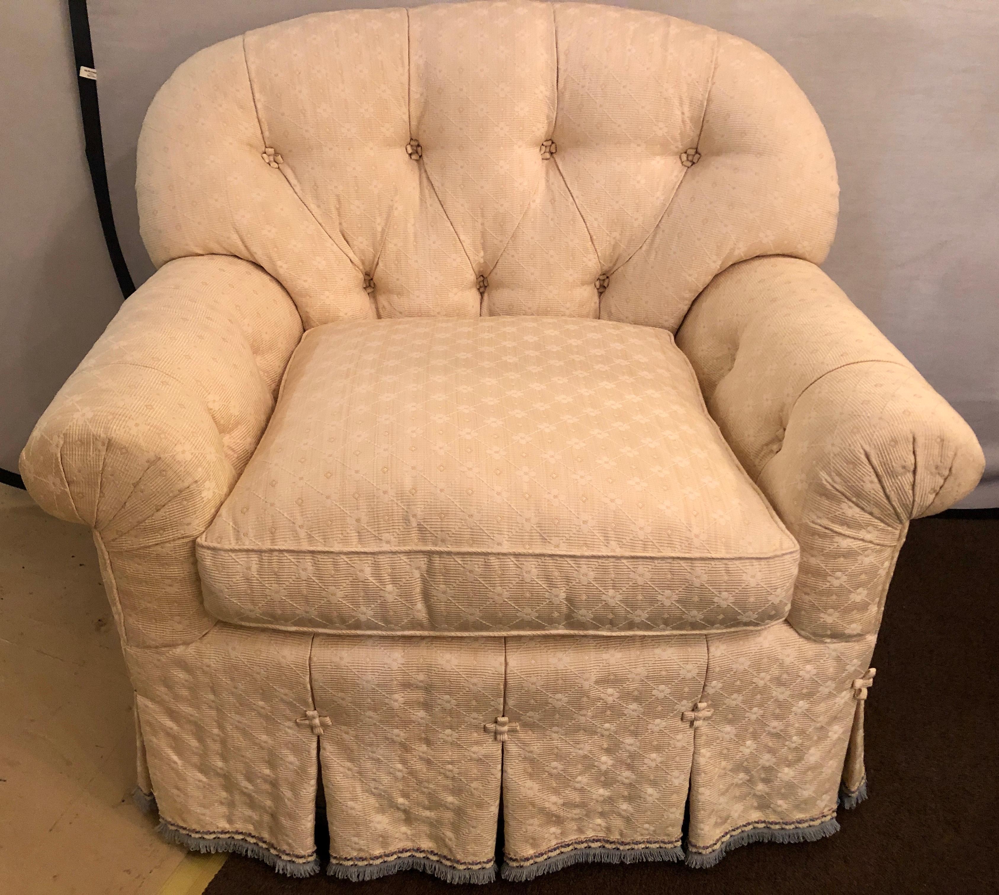 Hollywood Regency style abounds in this finest pair of lined and pleated spectacular overstuffed boudoir or lounge chairs each having a tufted back rest and tufted reverse. Too much to mention in these simply stunning custom quality, most likely o