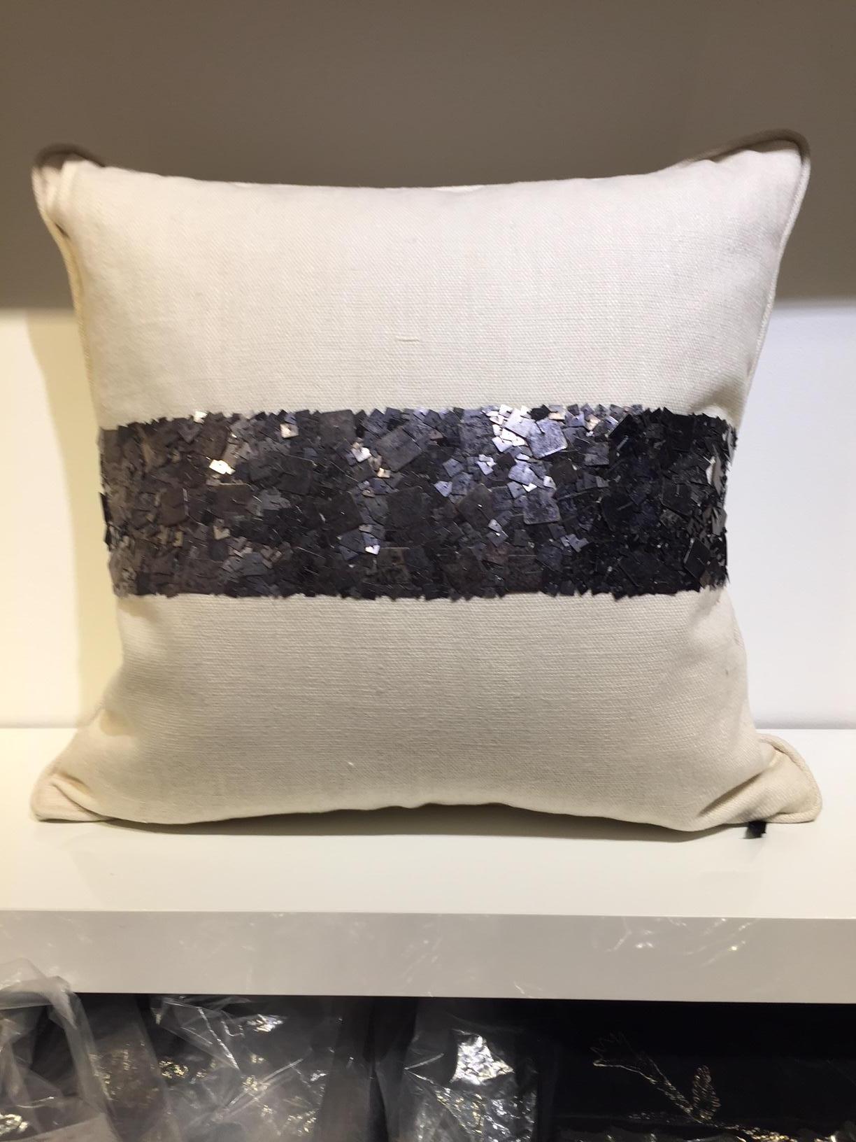 Pair of cushions, size 50x50cm, hand embroidered with metal sequins col. Dark silver, base fabric handwoven linen col. Off-white, cushion cover with cotton lining, self piped, concealed zip, inner pad 100% new goose feathers.