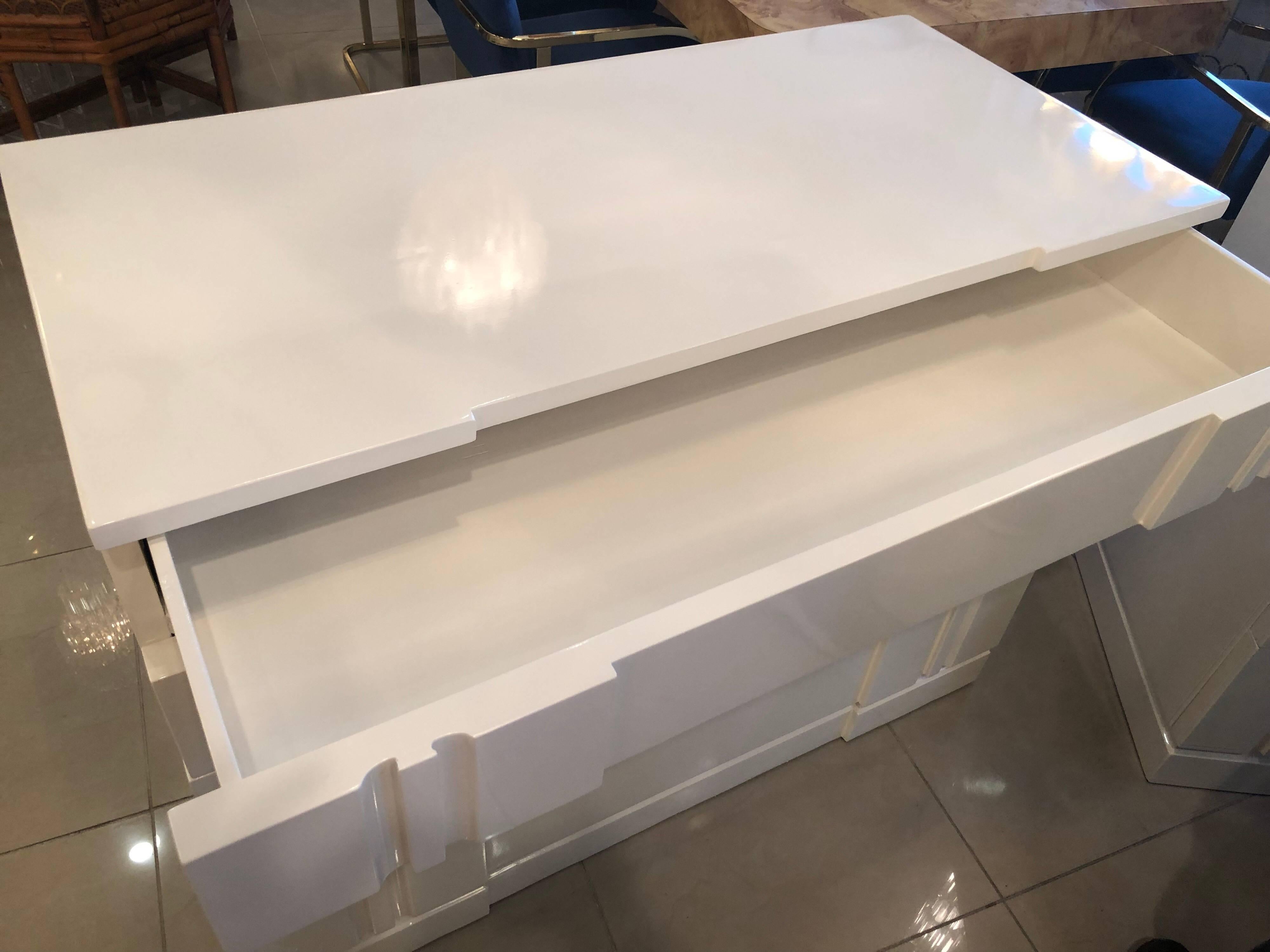Newly lacquered, including inside of all drawers, in a lovely linen white, pair of bachelor chests nightstands dressers. Clean, modern look. In the style of John Stuart. 