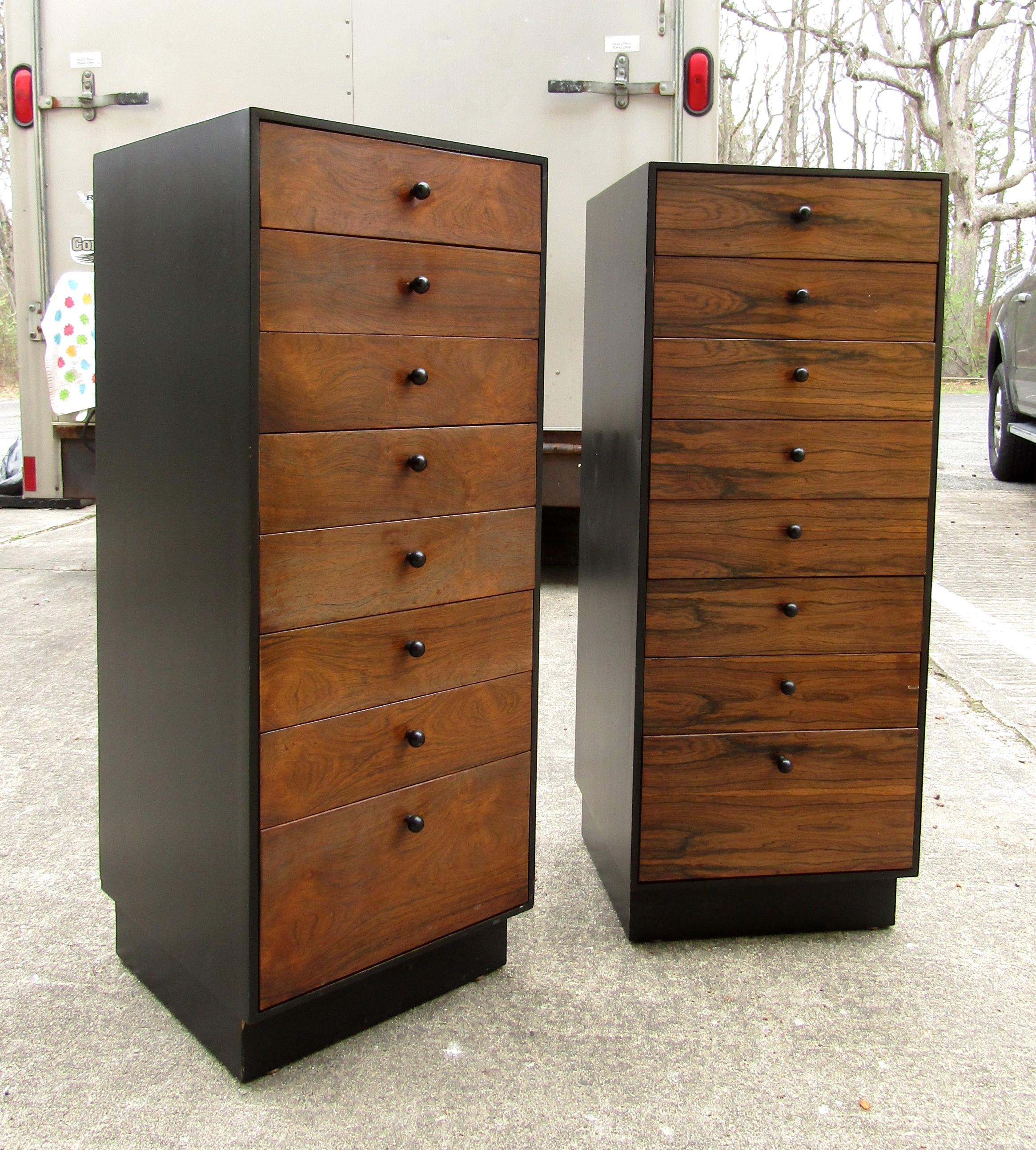 Mid-Century Modern pair of lingerie chests by founder featuring multiple wooden drawers, black round knobs, and sides.

Please confirm the item location (NY or NJ).