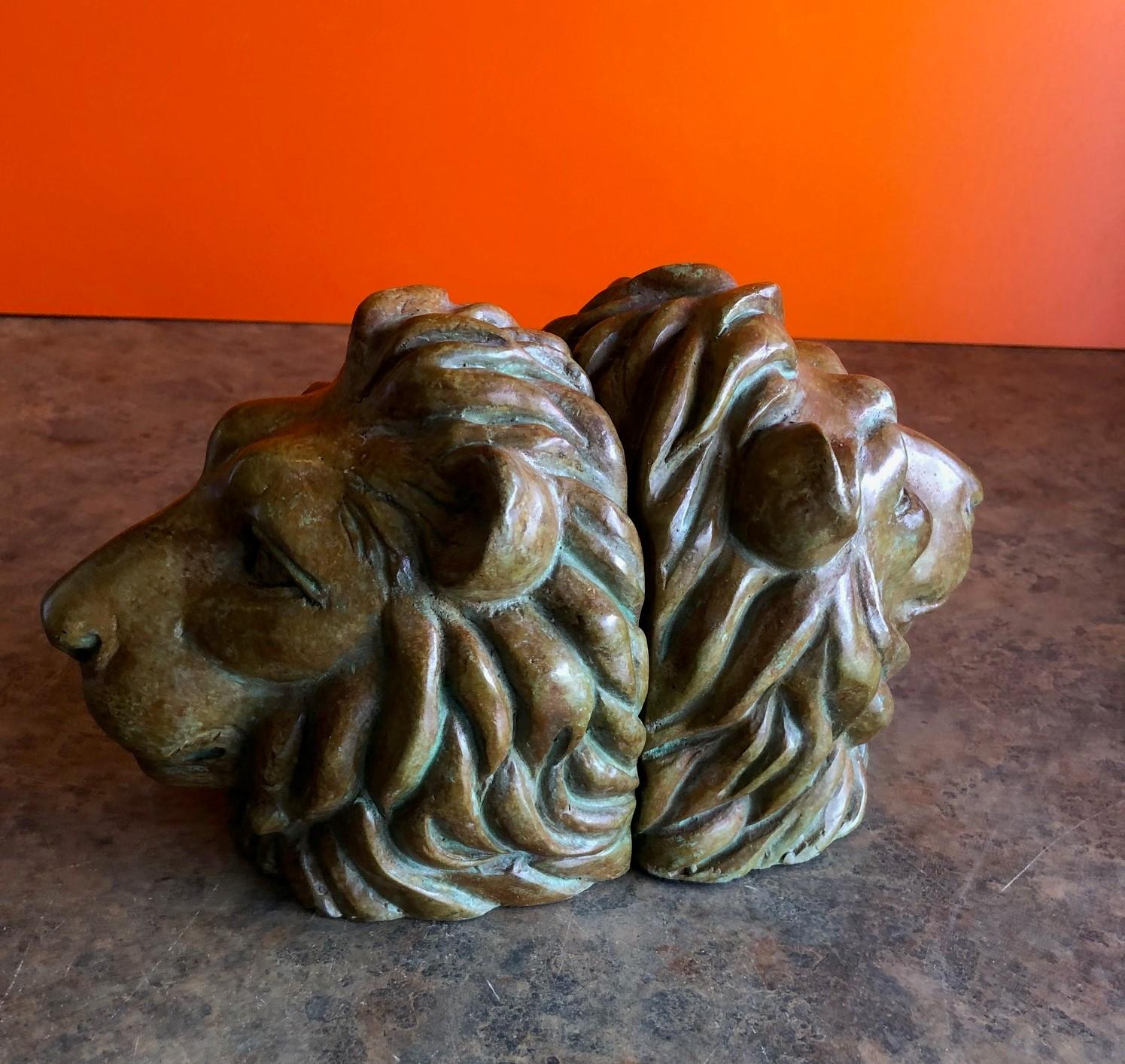 Classic pair of majestic lion head bookends in bronze, circa 1970s.