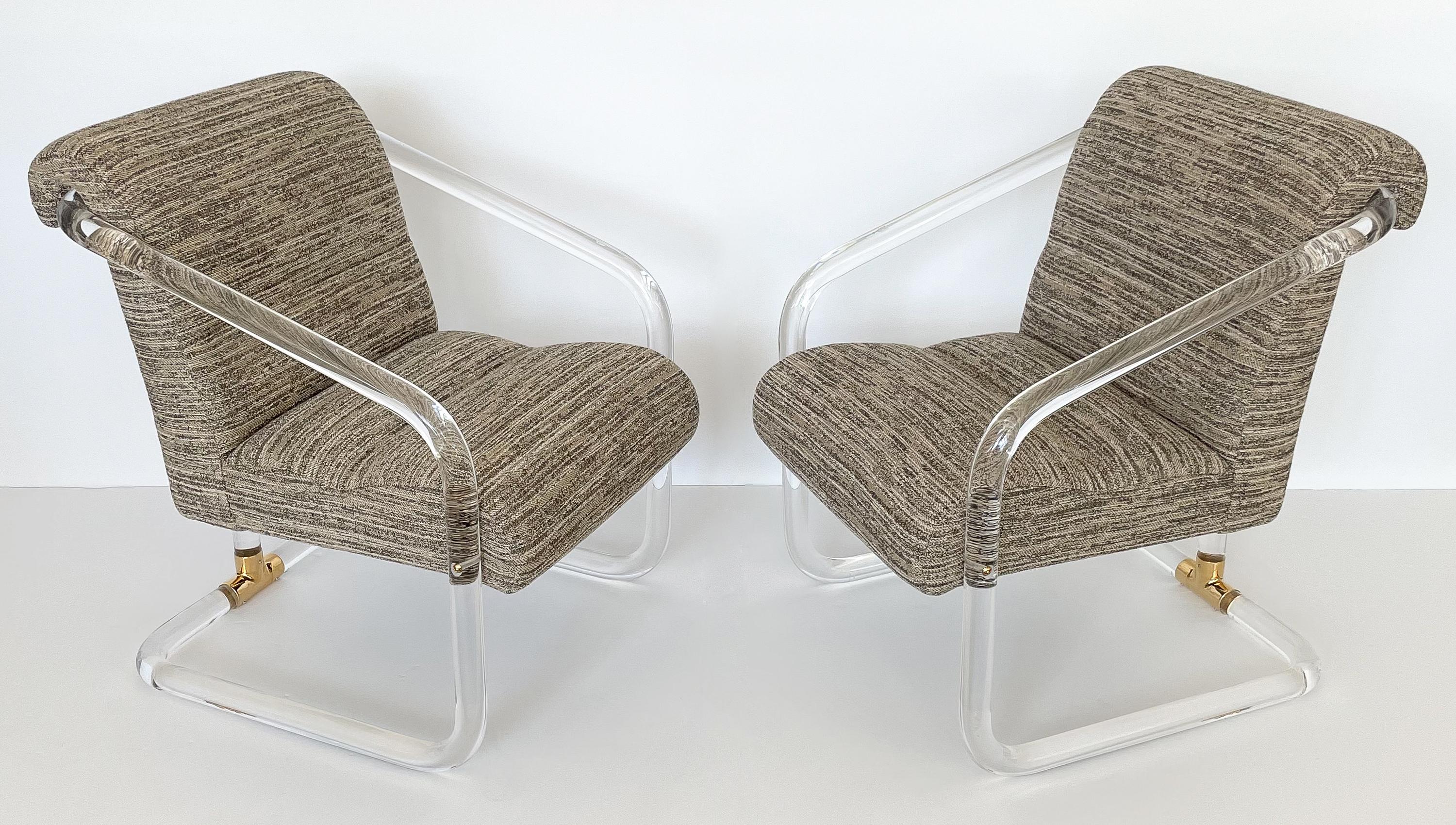 Pair of lucite and brass armchairs by Lion in Frost (Leon Frost), circa 1970s. These chairs feature a framework of bent 1.75
