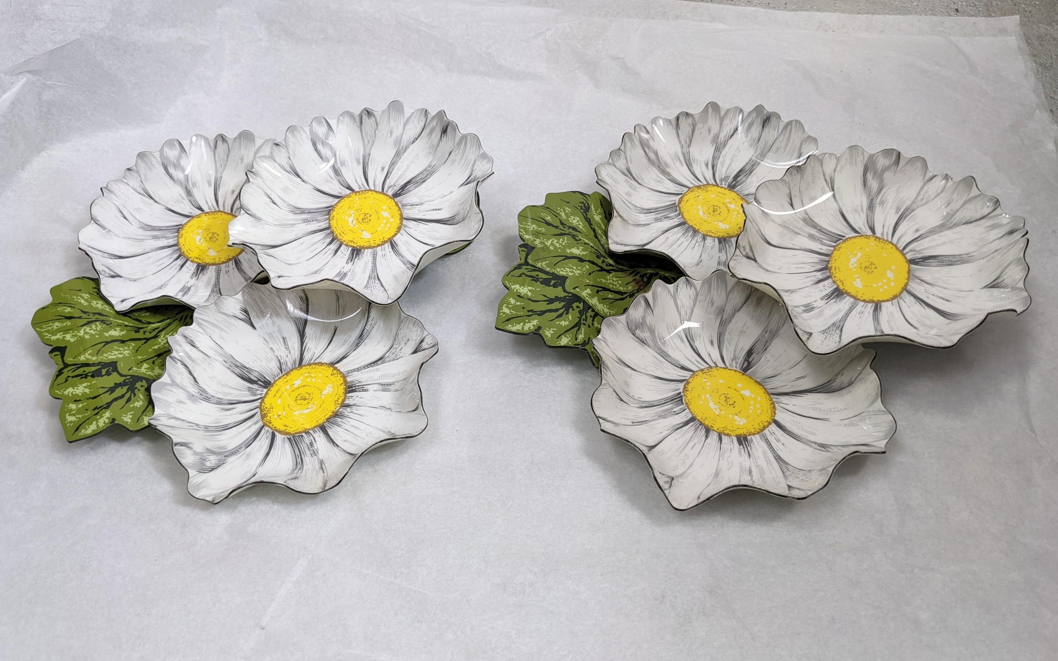 Pair of charming lithographed lucite daisy servers on a leafy green base. 2 daisies are on table level and one is elevated on each. Made by Stotter, 1960's. 