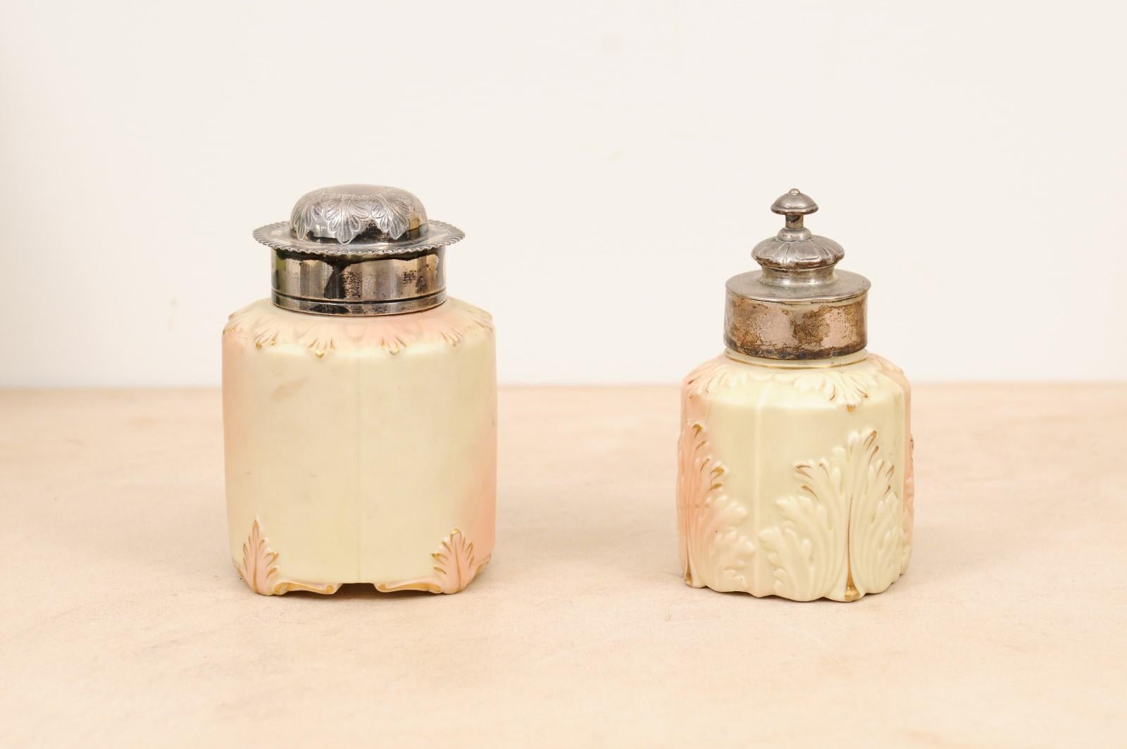 A pair of Turn of the century porcelain toiletry jars signed Locke & Co, Worcester England. Created by Edward Locke in the English Shrub Hill Worcester factory during the late 19th, early 20th century, each of this this lovely toiletry jar features