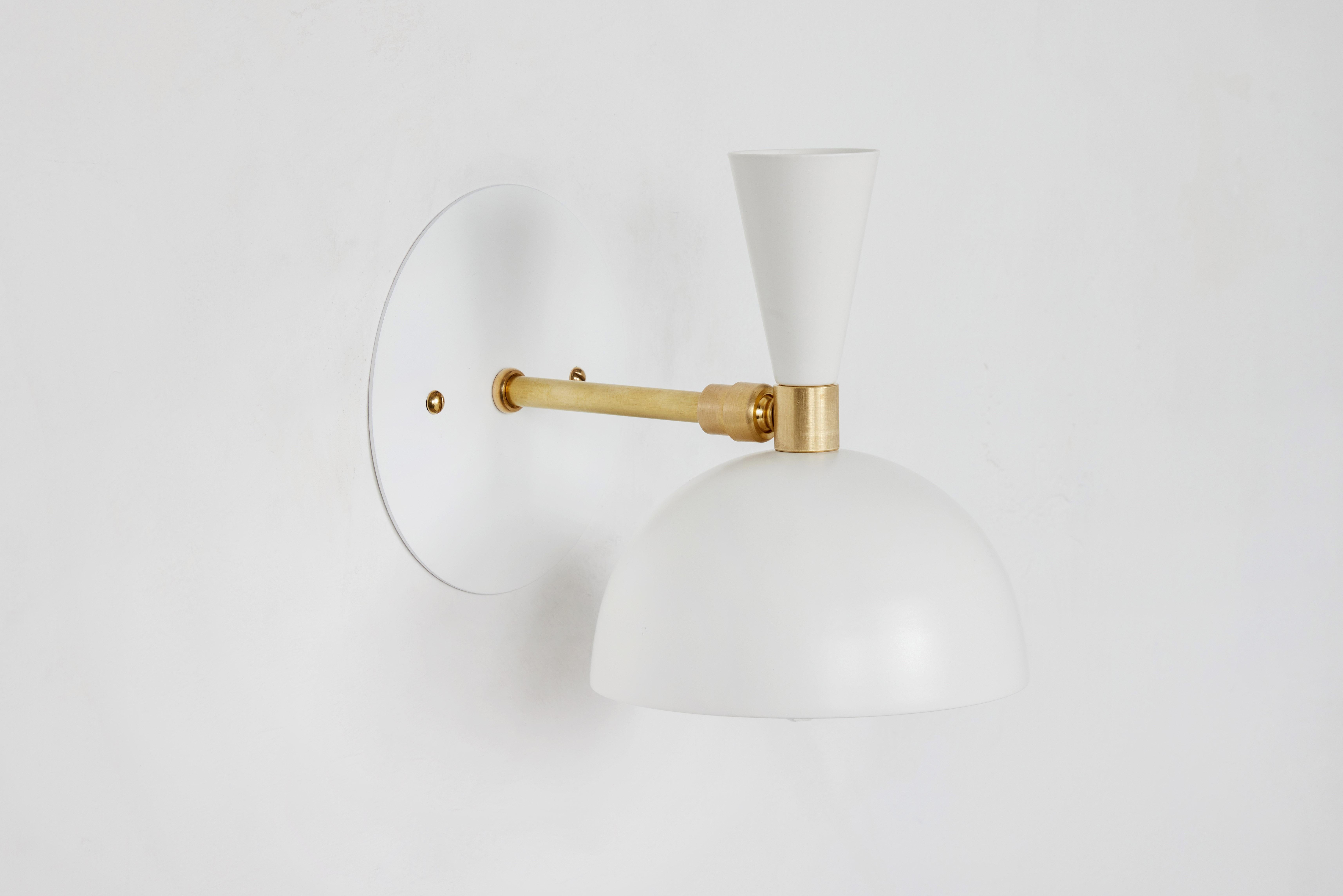 Pair of 'Lola' brass and metal adjustable sconces in white. Hand-fabricated by Los Angeles based designer and lighting professional Alvaro Benitez, these highly refined sconces are reminiscent of the iconic midcentury Italian designs of Arteluce and