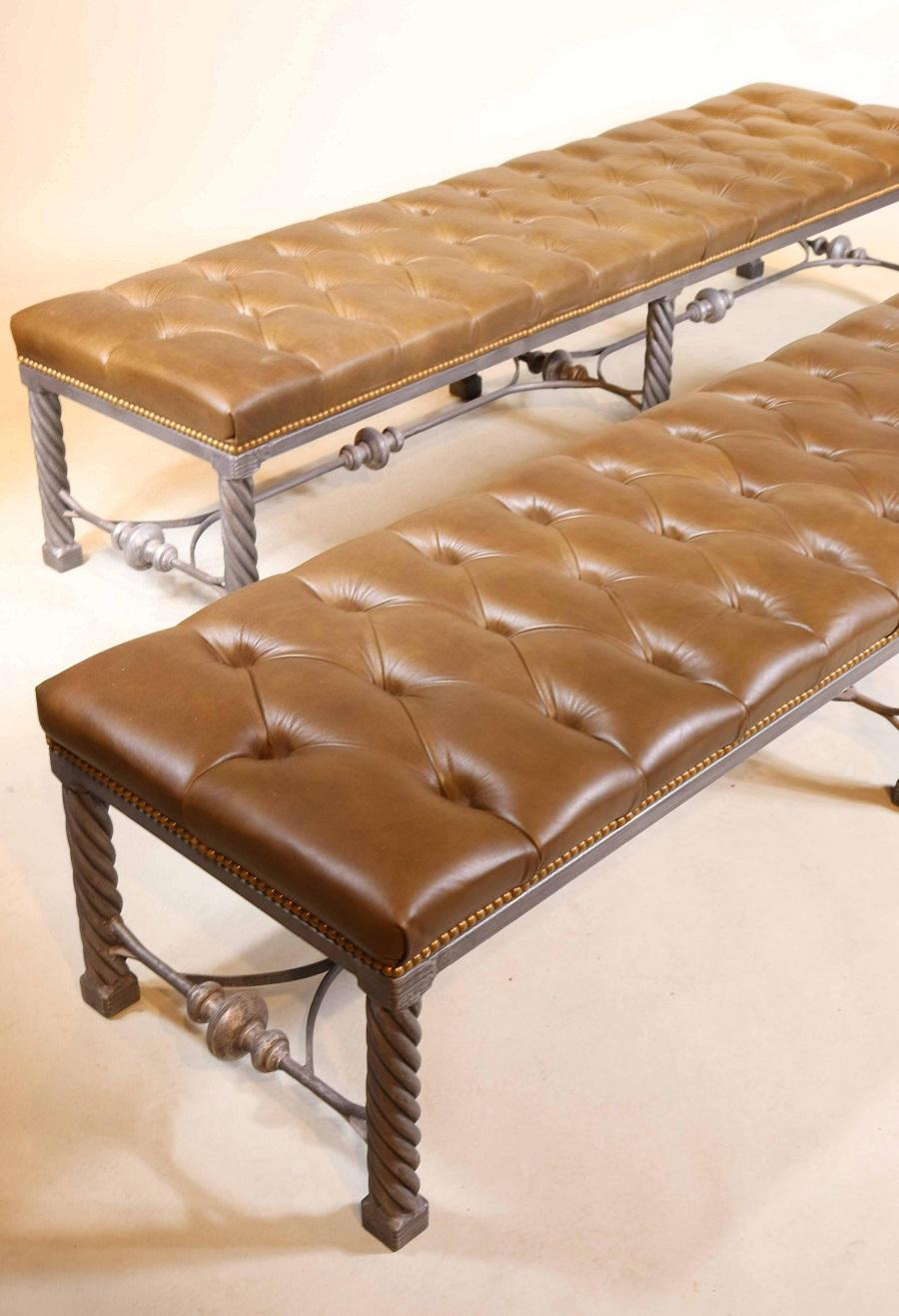 Pair of long modern Tufted leather benches. The frames of the benches are white metal.
