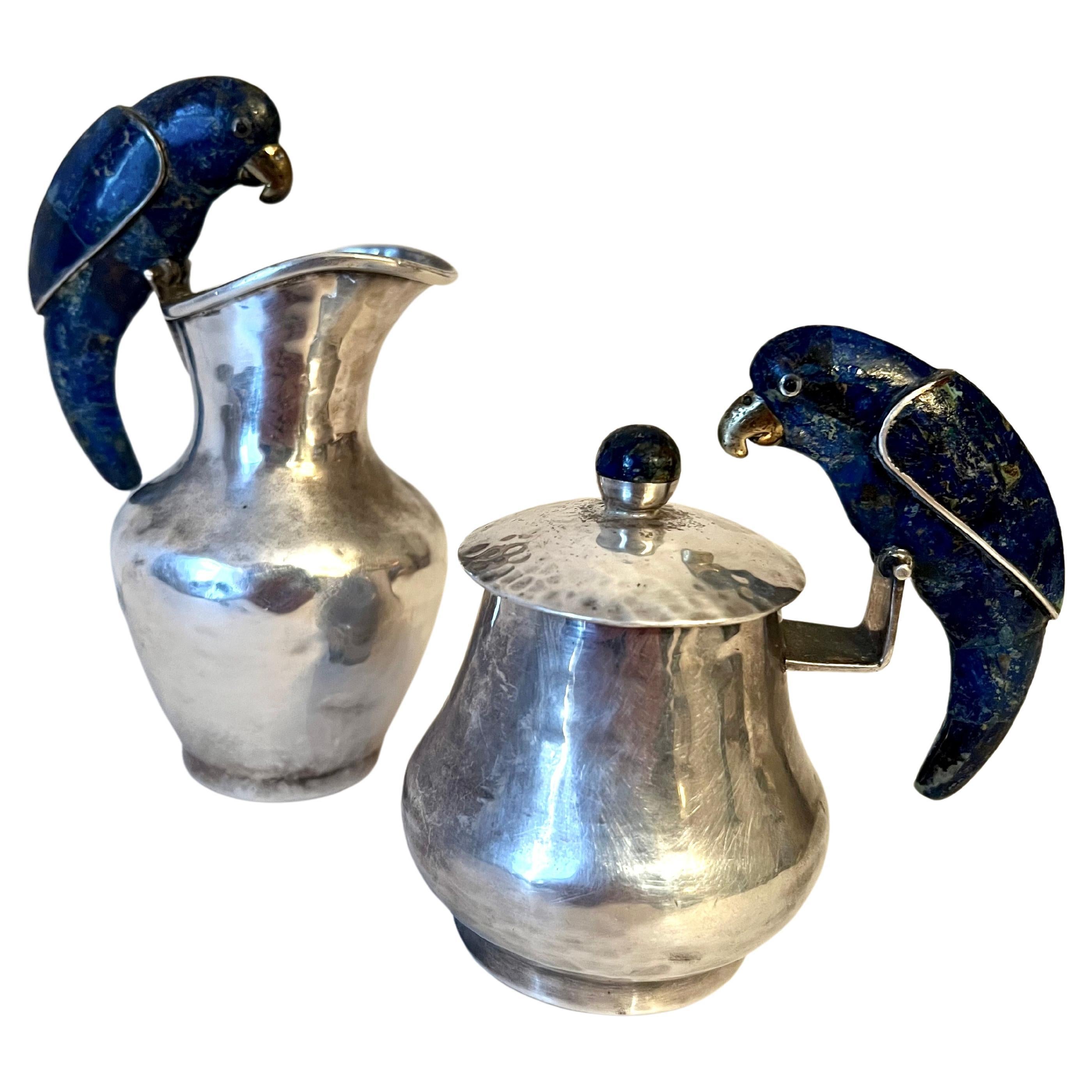 A stunning and rare pair of sterling silver Los Castillo cream and sugar.  The Mexican Silver is made in Taxco Mexico by the iconic Los Castillo.  Hand made with a hammered quality.  The pieces ability to easily go from obscure to one of the most