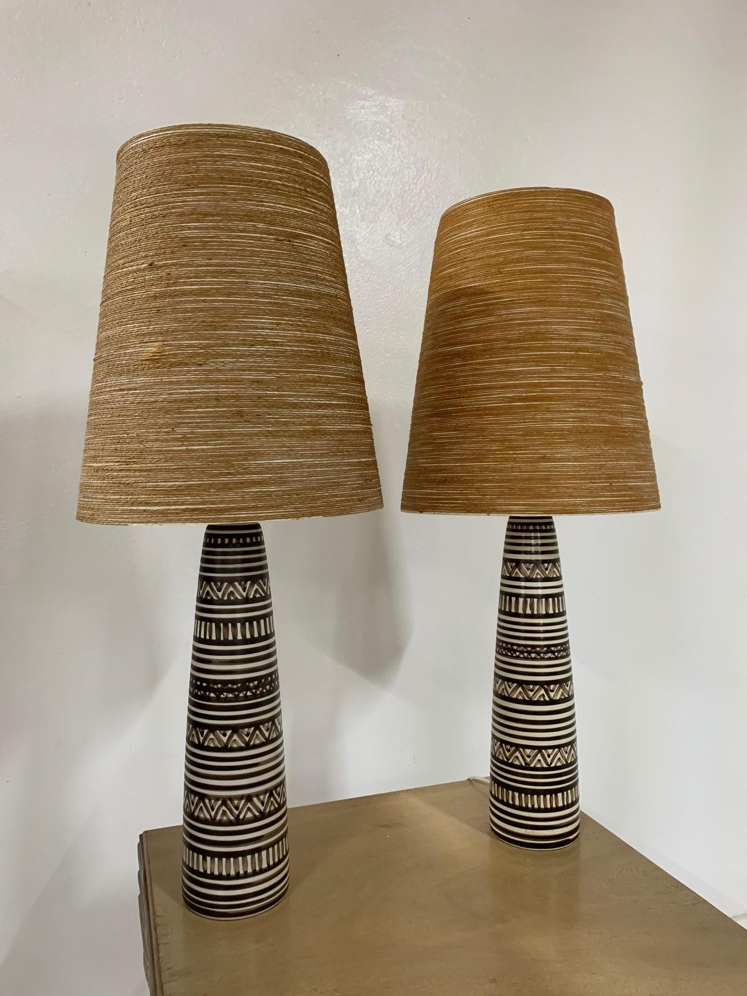 Pair of hand-painted pottery lamps designed by Lotte and Gunnar Bostlund. Has fiberglass shades.