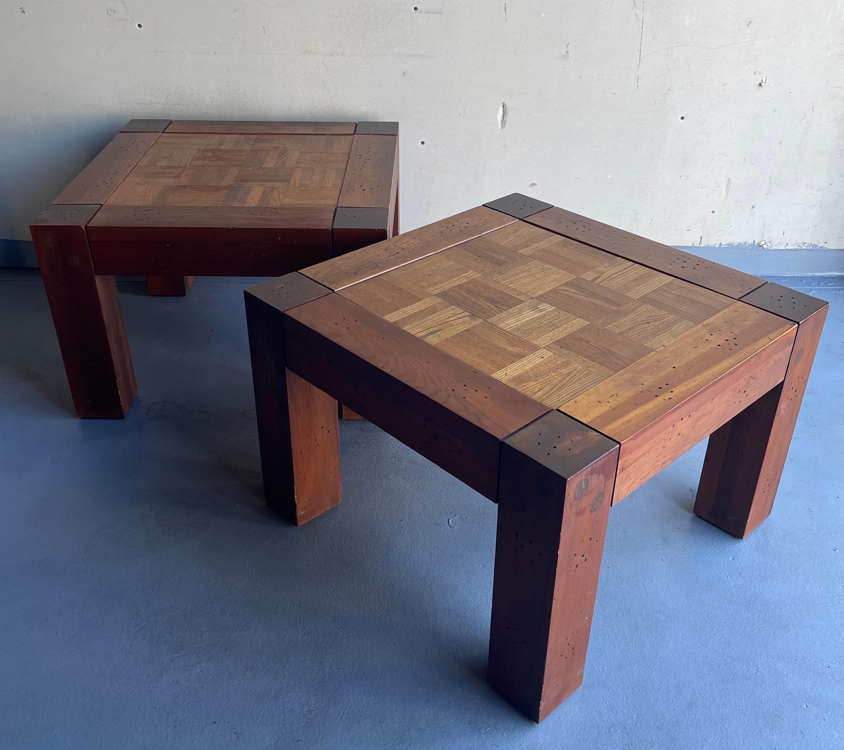 A nice pair of Lou Hodges style California design walnut and parquet oak end tables, circa the 1970s. A beautiful combination of solid oak and walnut frame with a great parquet design The tables are assembled with wood pegs (no nails) and have been