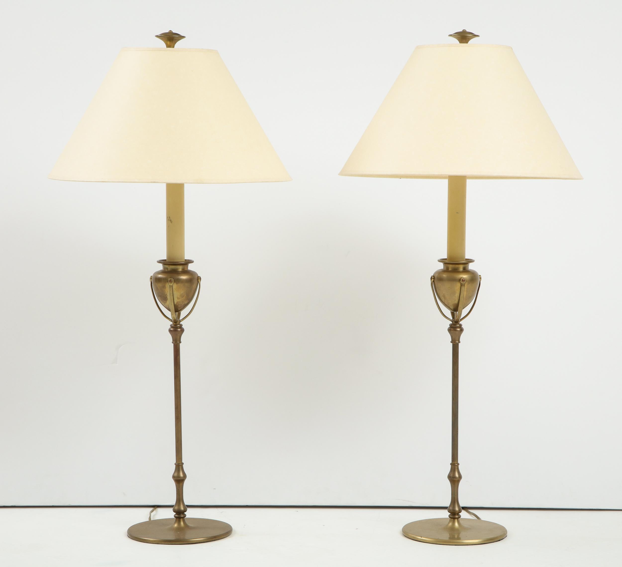 Unusual pair of 1970's bronze lamps, clearly inspired by the Tiffany Studios bronze candlestick, but with more streamlined design.

Height below is to finial, diameter is of base.