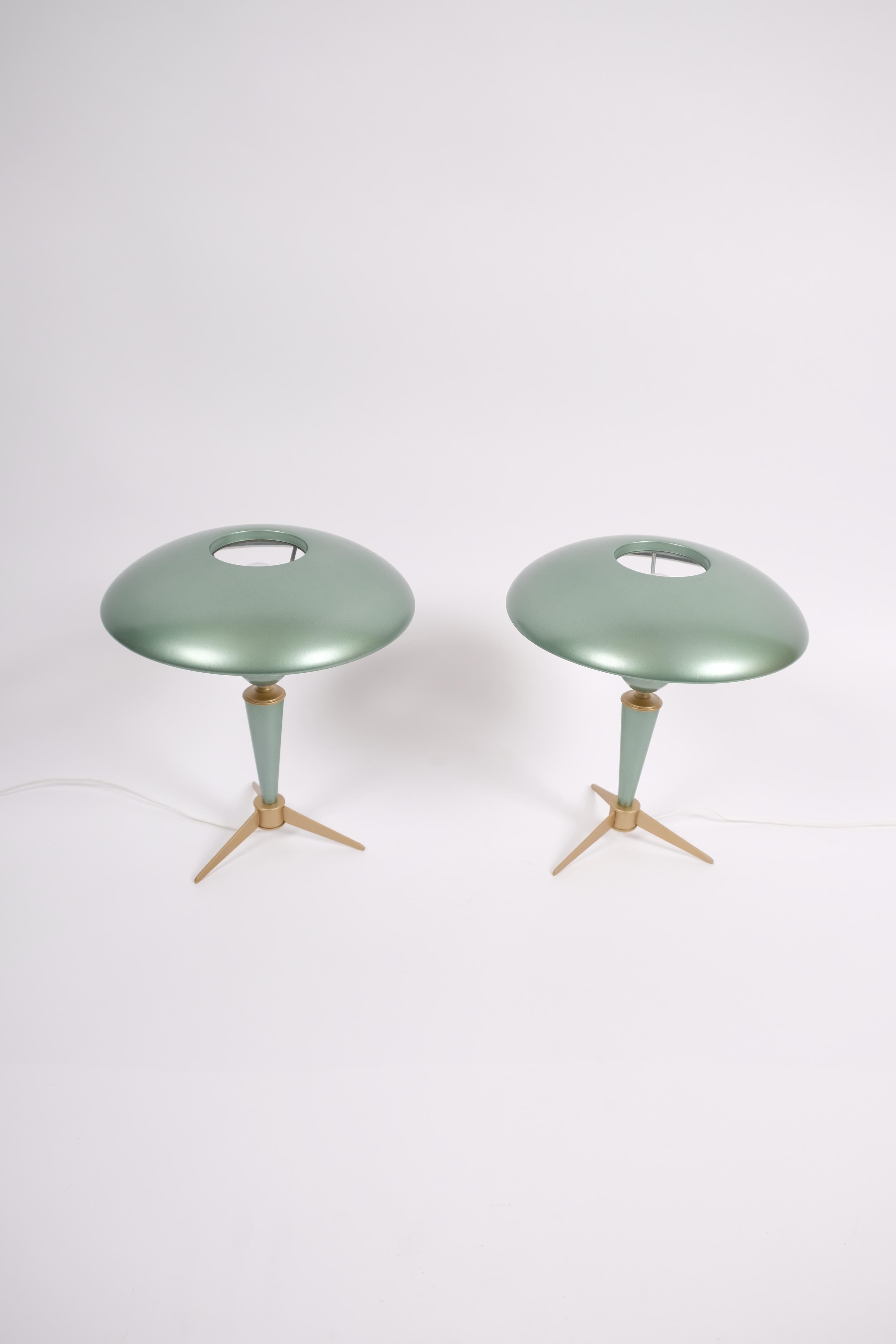 Wonderful pair of Bijou table lamps by Louis Kalff.
Both lamps have been proffesionally relacquered in light green metalic and rewired.
One of the lamps still have the original label.
The lamps have minimal soft dents - see last picture.