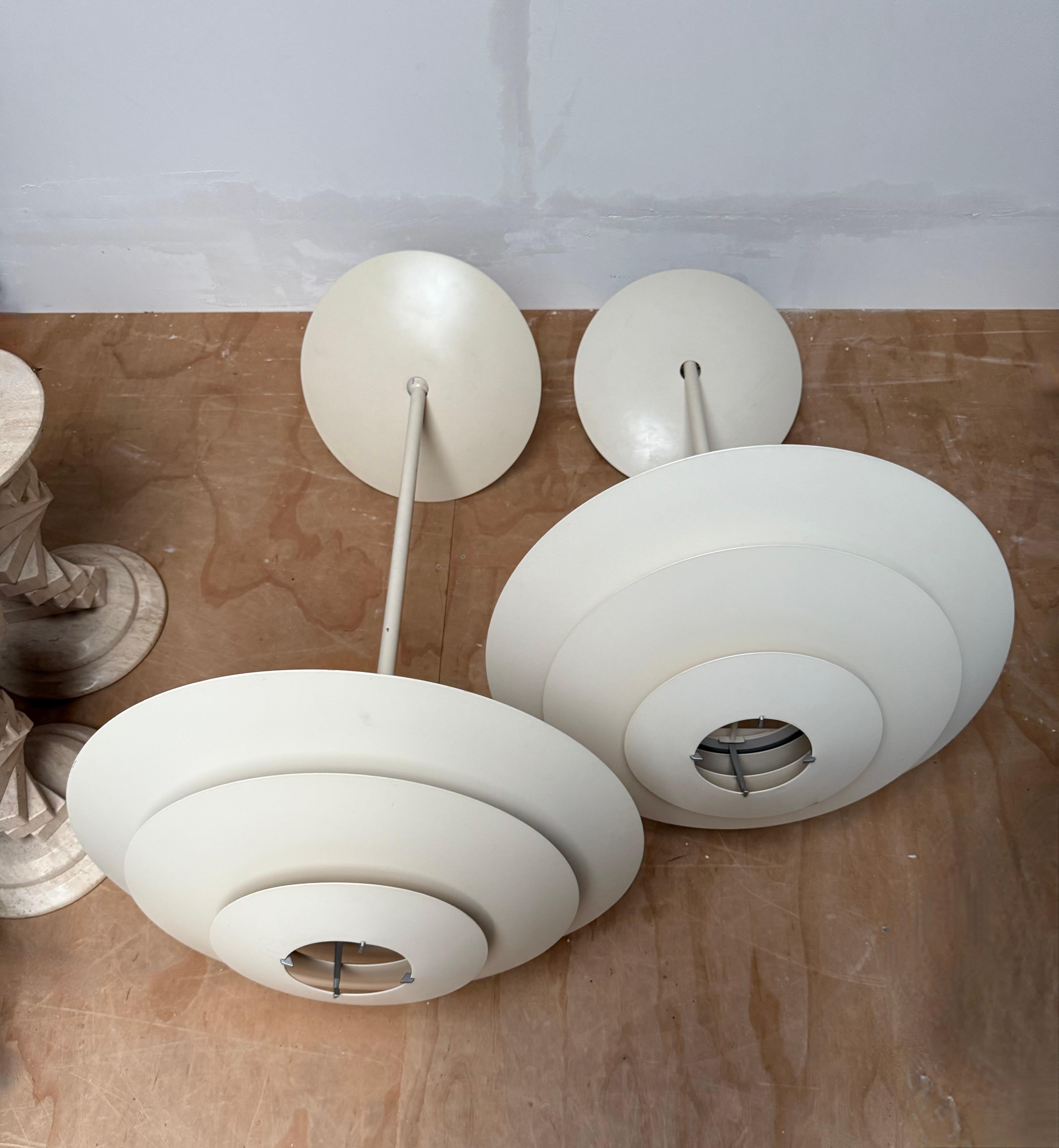 Set of two original Louis Poulsen “Oslo” pendant lamps designed by Kurt Nørregaard in the 1980s. 

Large pair fixtures, designed to provide soft and glare-free light. A classic example of Danish modern lighting, functional and minimal in
