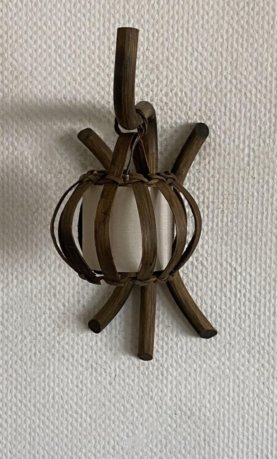 Hand-Crafted Pair of Louis Sognot Bamboo Rattan Wall Sconces with Shades, France, 1960s For Sale