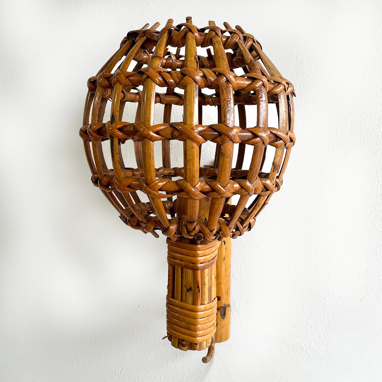 Pair of Louis Sognot french bamboo wall sconces.
Sculptural rings create a unique shade, which illuminates in a beautiful pattern.
Newly rewired.