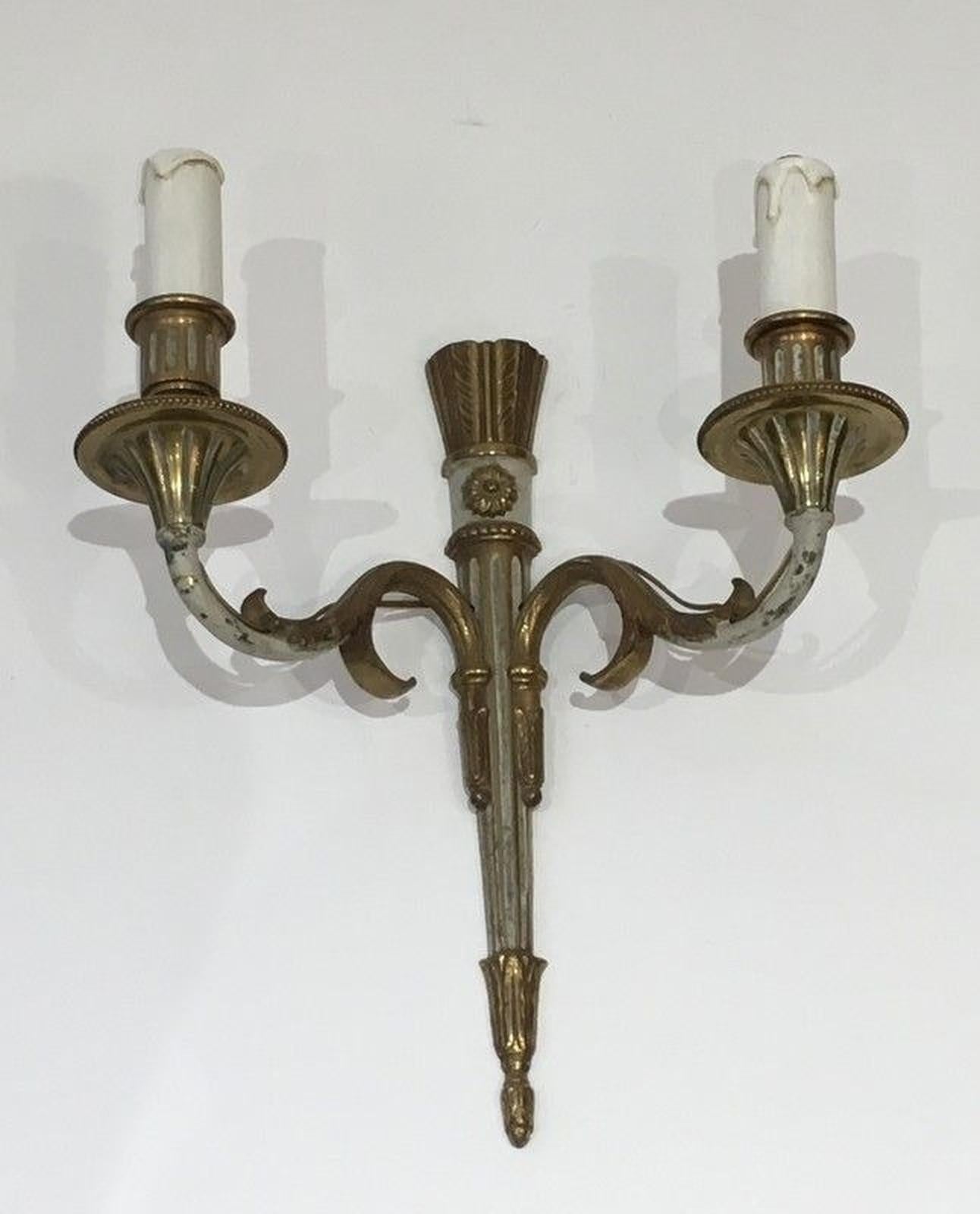 This pair of Louis the 16th wall sconces is made of bronze and white painted bronze. This is a French work. Circa 1940