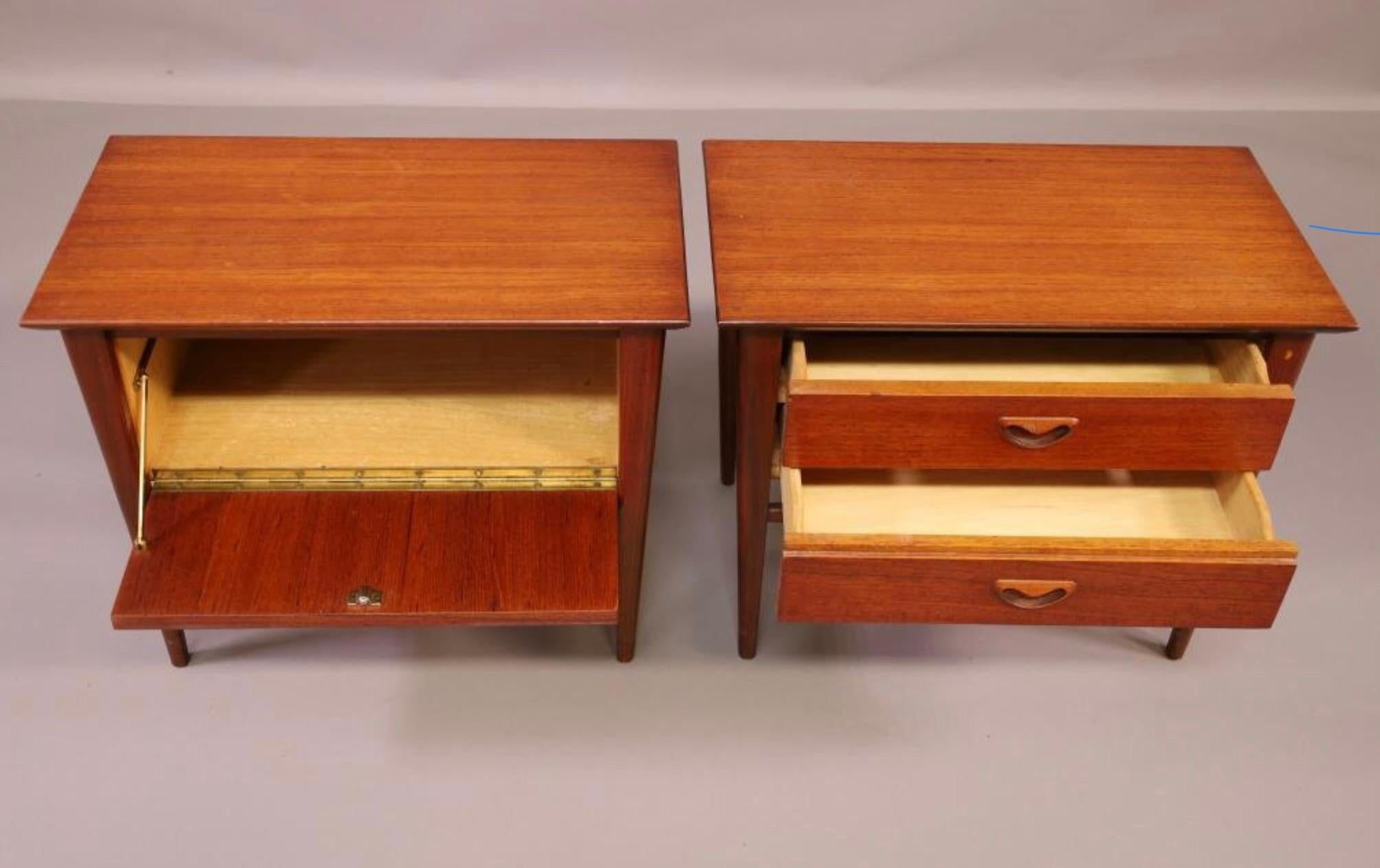 Lovely dimunitive pair of teak nightstands or end tables designed by Louis Van Teeffelen for Webe Meubelen. A matched pair they are different and complimentary. One has two drawers, the other has a drop front. They are in good age appropriate