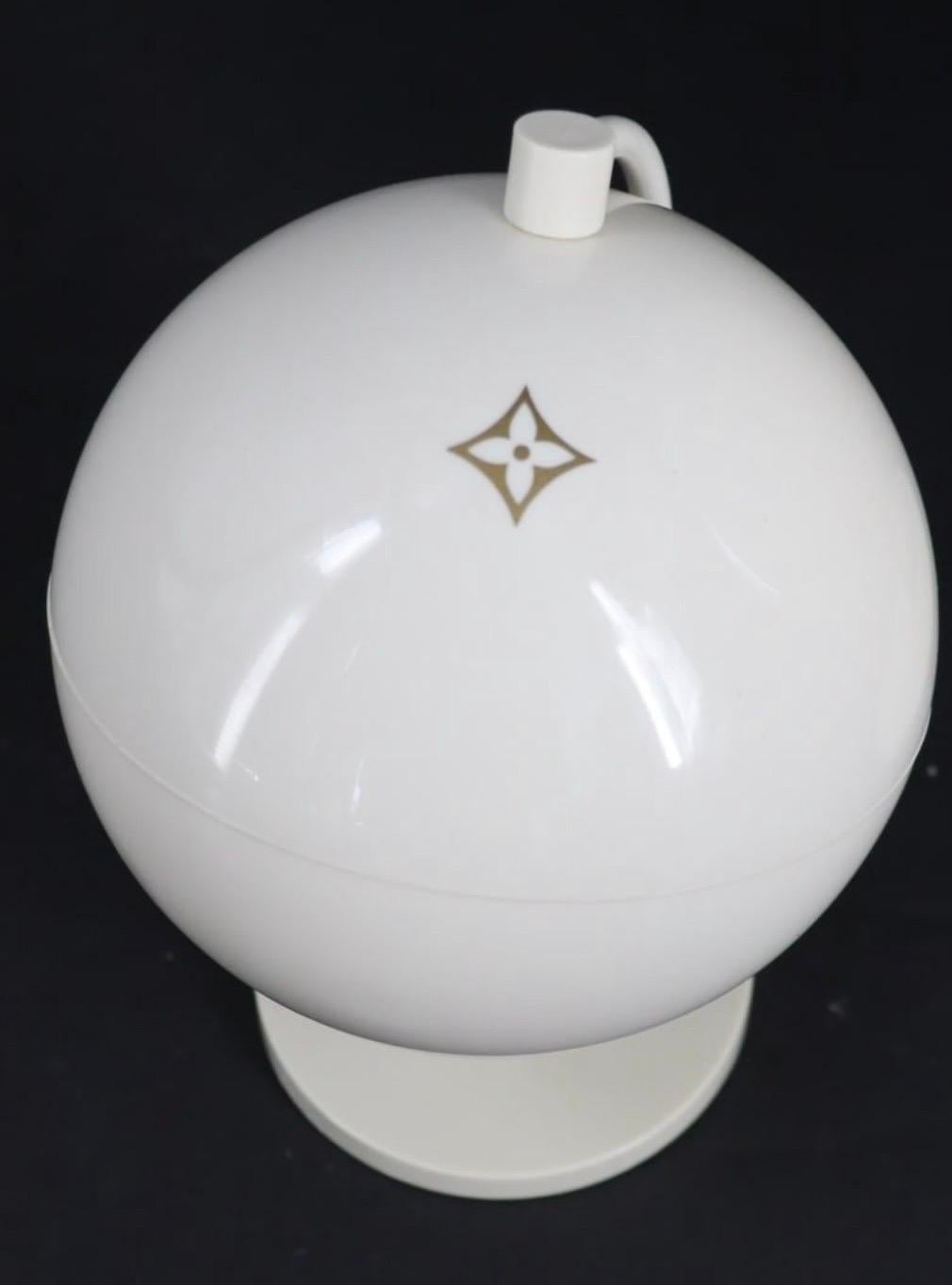 Post modern set of 2 Louis Vuitton white globes from a New York City Louis Vuitton store promotional display.  Features spinning globes with white surfaces and icon from Louis Vuitton pattern.

Dimensions of each are: 14
