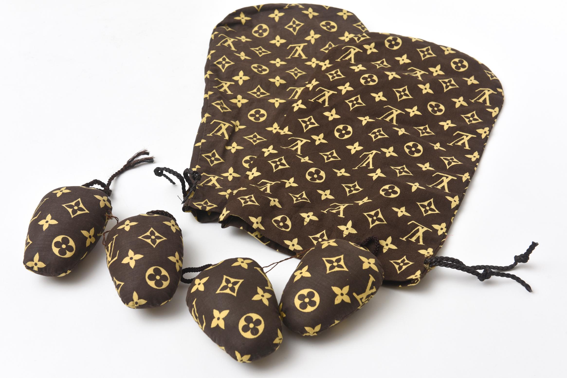 These amazing pair of never used vintage Louis Vuitton shoe bags with shoe stuffers are canvas coated monogrammed Louis Vuitton insignia. They will only fit a flat shoe that is not wide like a slipper of flats. They will not fit heels. They can be