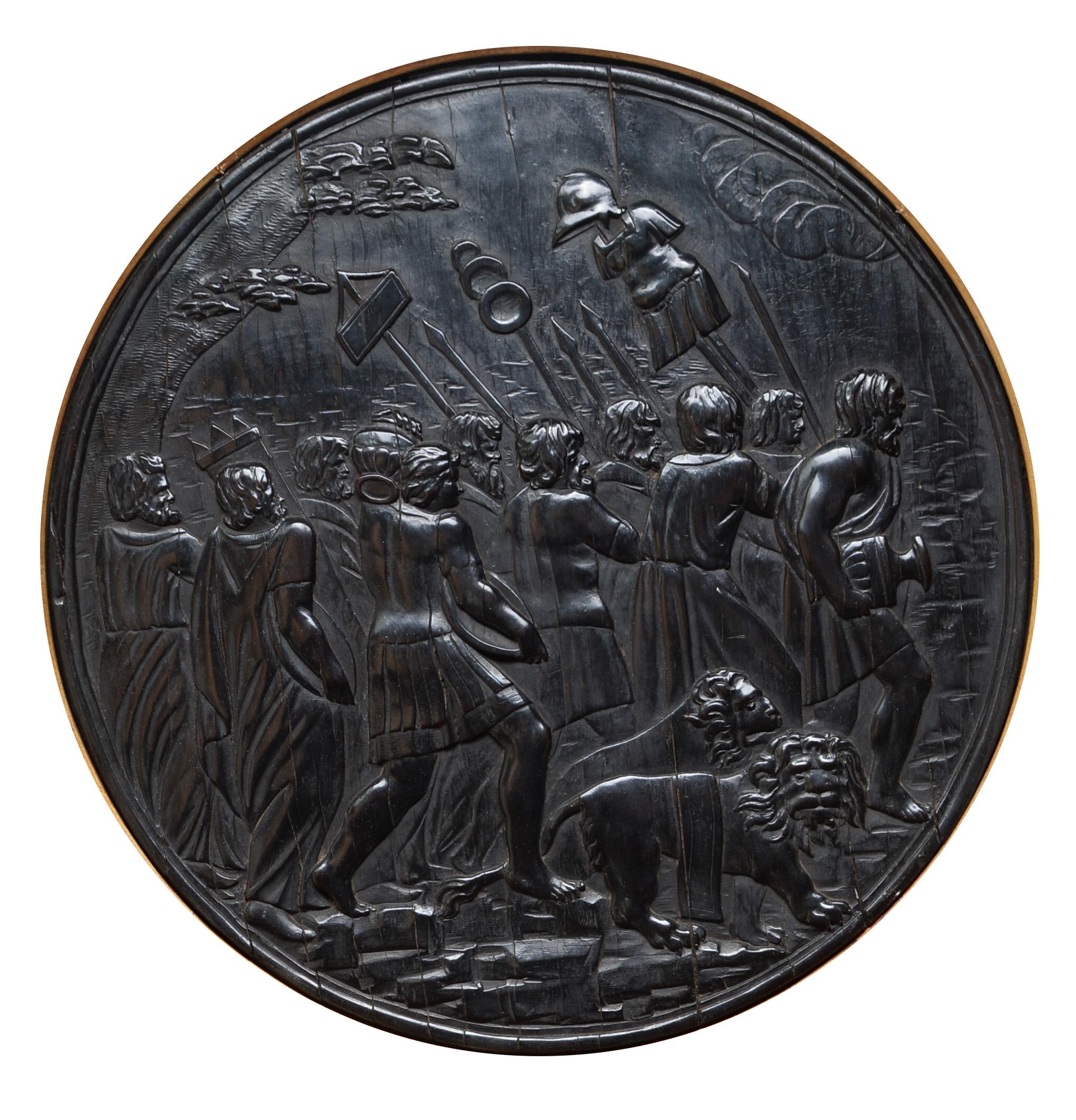 Each ebony tondo carved with Roman military scenes in low relief, set in gilt Florentine style frames. Formerly part of the front doors of a cabinet. With an old label at the back of the frame, Ernest Samson, Paris.
13 1/4in. diameter sight (the