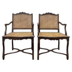 Pair of Louis XIII style armchairs in wood and caning