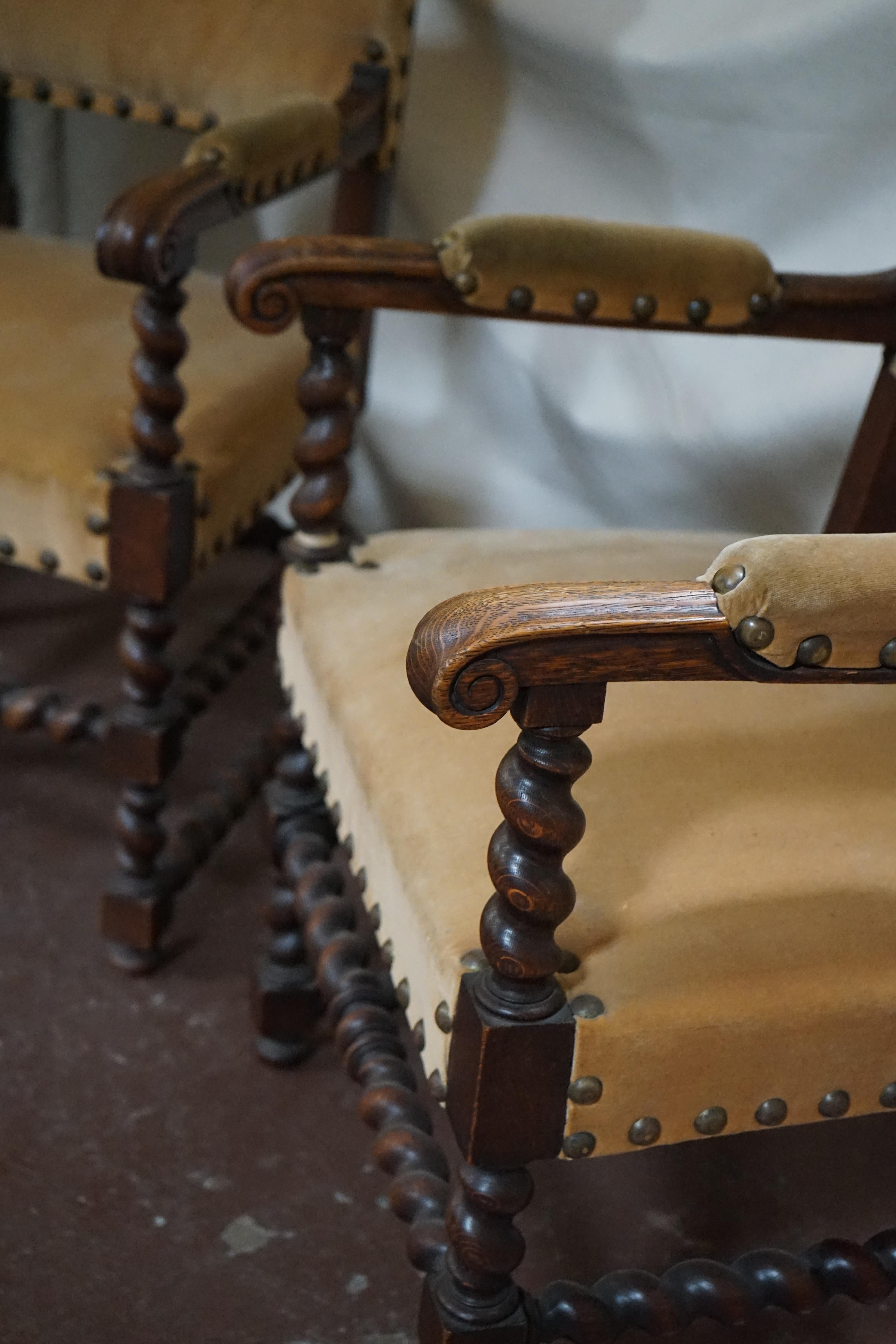 This set of two Burgundian armchairs feature barley twist legs and gold-hued upholstery. Originating from France, circa 1870.

Measurements: 36