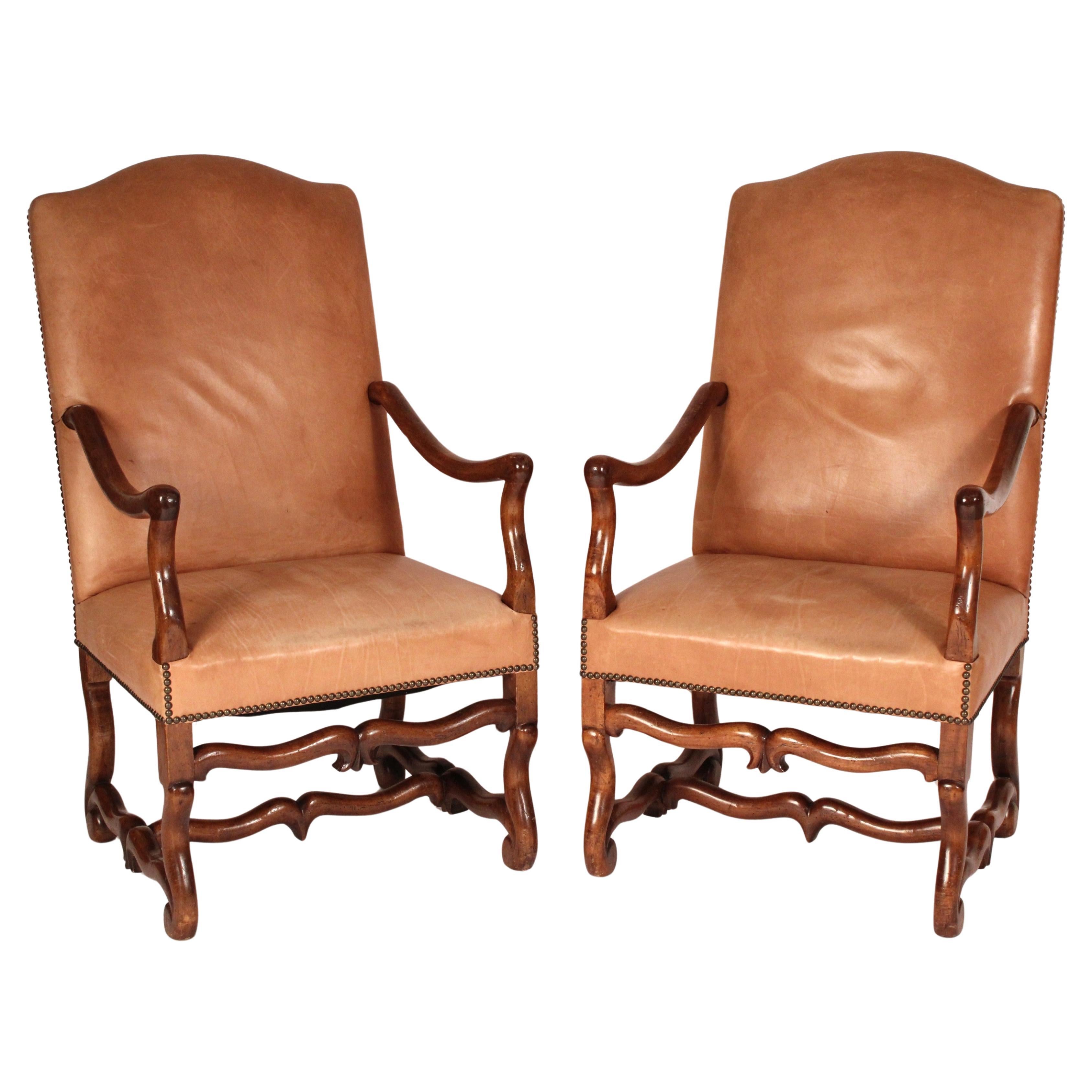 Pair of Louis XIV Style Leather Upholstered Walnut armchairs