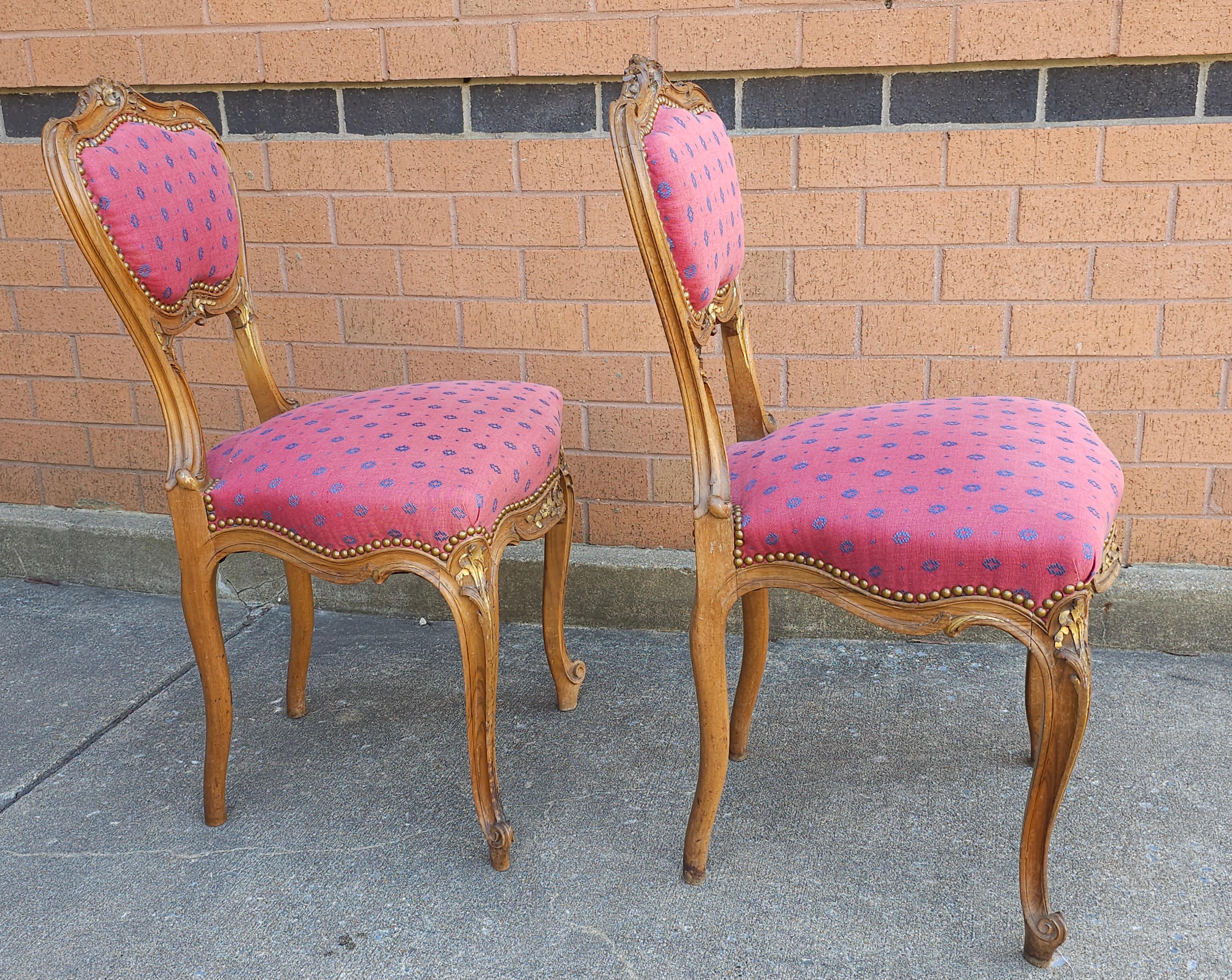Hand-Carved Pair of Louis XV Carved Fruitwood Brass Nail Studded And Upholstered Side Chairs For Sale