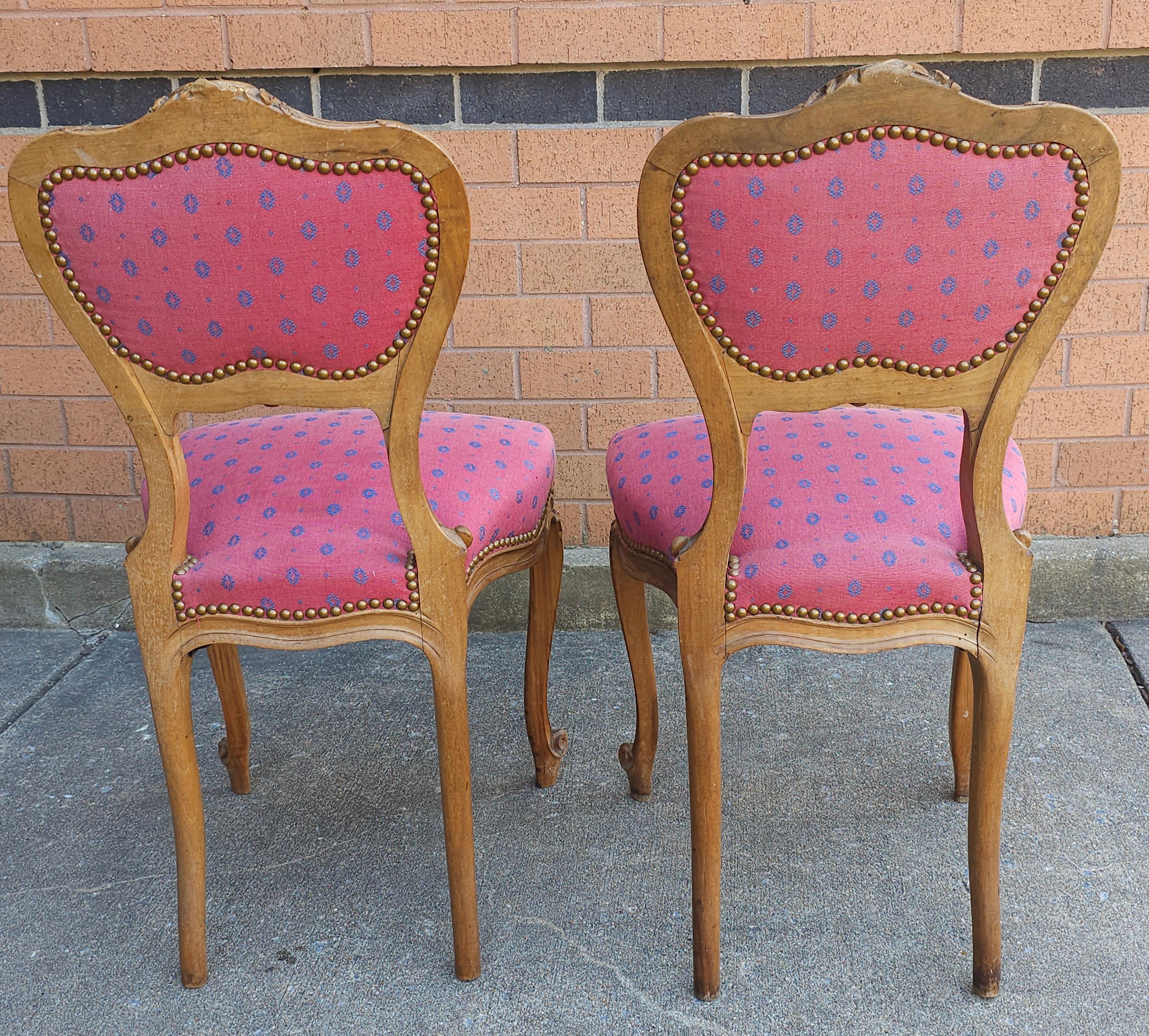 Pair of Louis XV Carved Fruitwood Brass Nail Studded And Upholstered Side Chairs For Sale 1