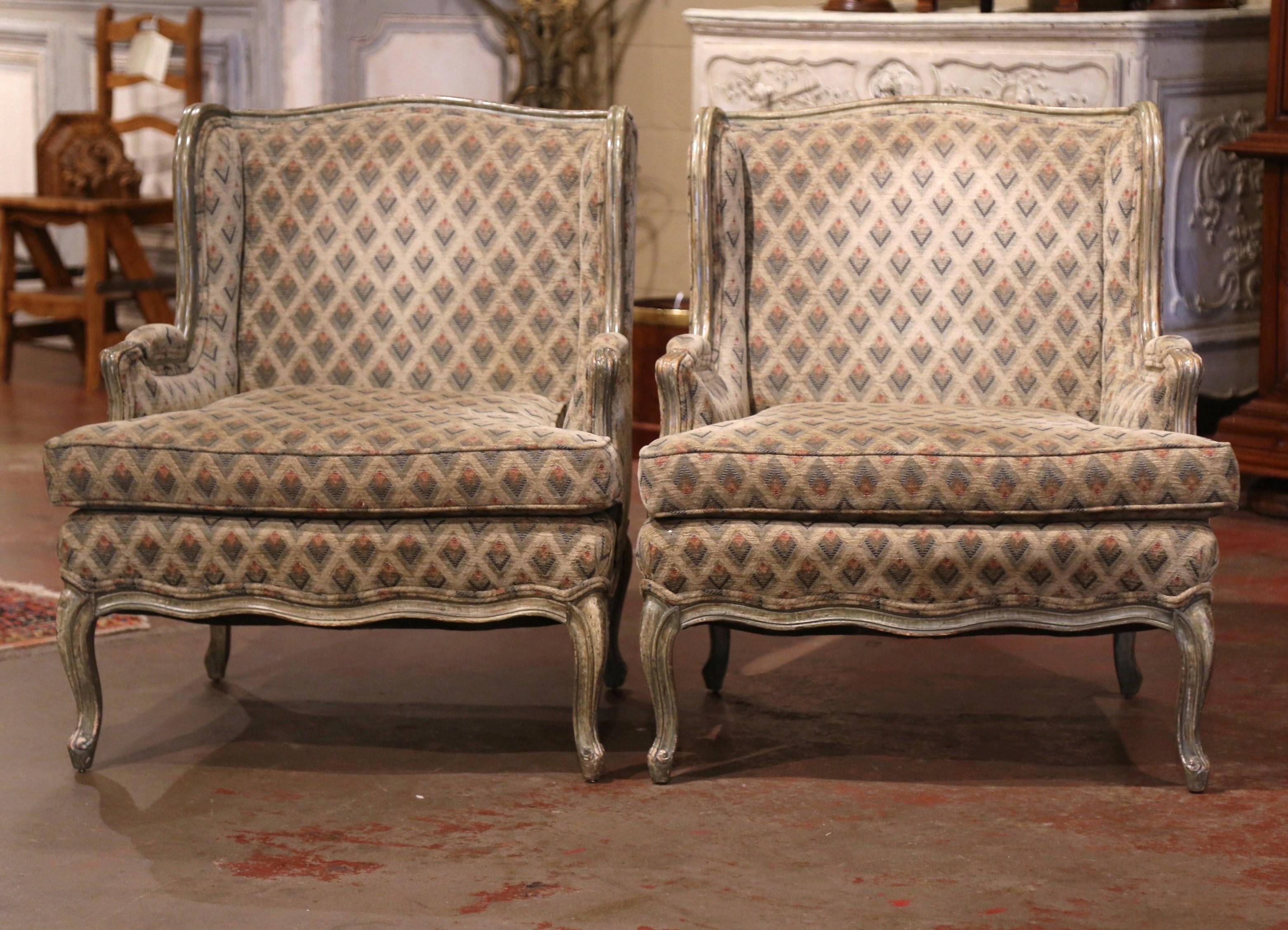 Dress a living room with this elegant pair of painted armchairs. Crafted by Minton Spidell circa 1980, each 