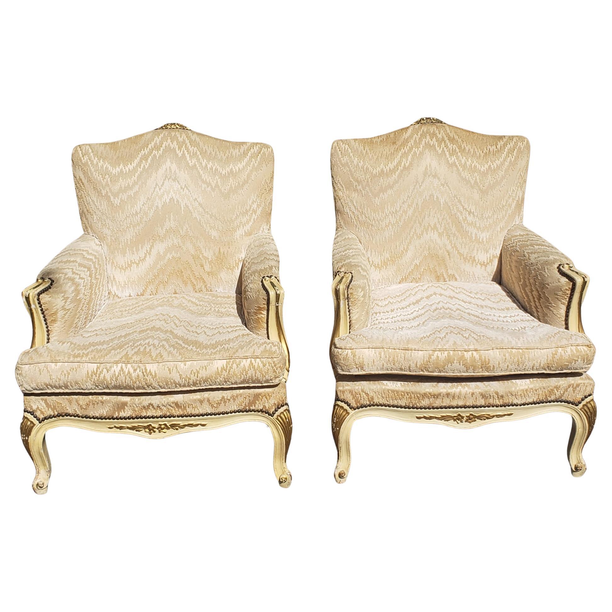 Pair of Louis XV Carved, Parcel Gilt and Upholstered Bergere Chairs