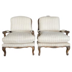 Pareja de sillones de bergere con doble respaldo de caña de estilo provincial francés Louis XV