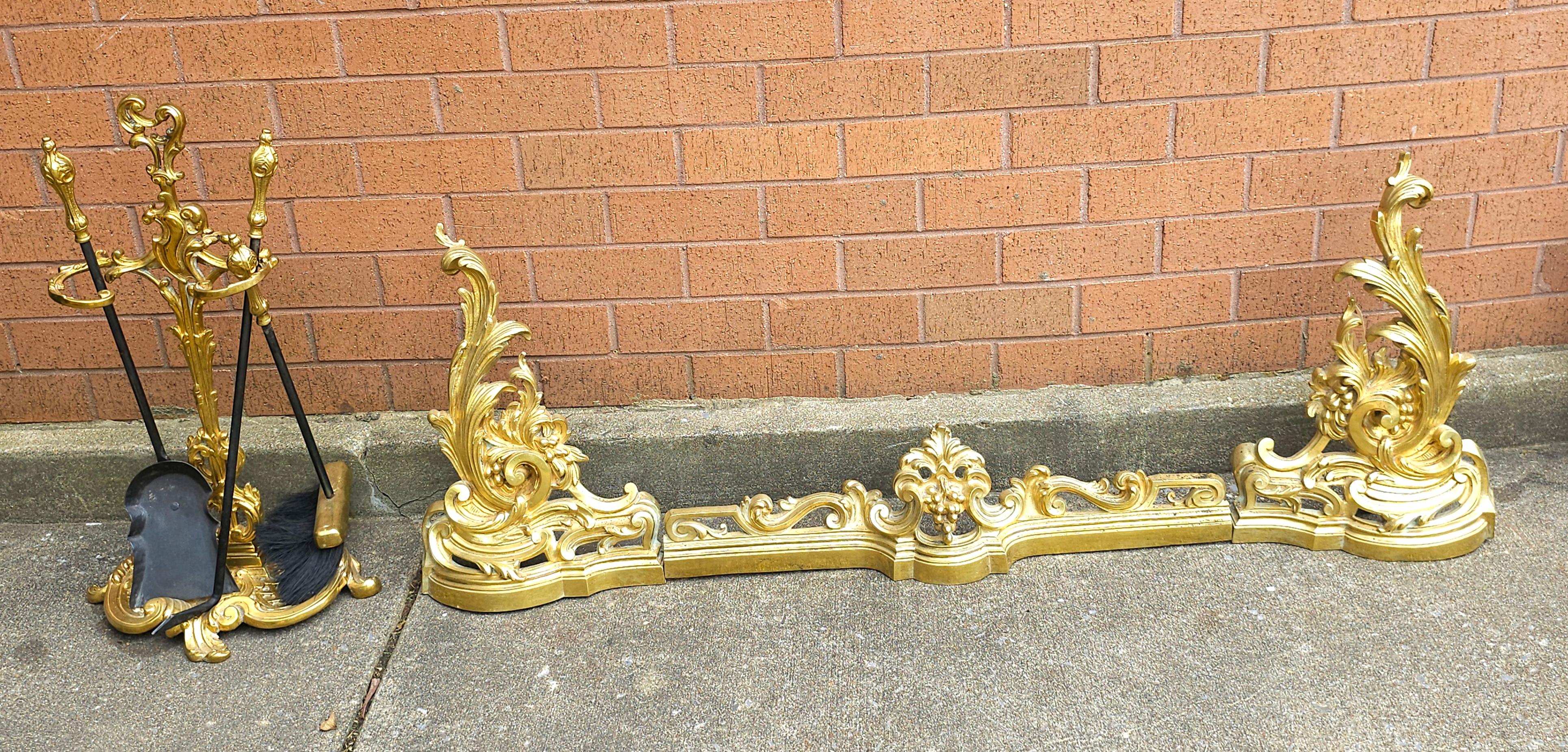 An exceptional Louis XV Style Gilt Brass Three Part Fire Fender, Tool Stand With Three Tools set in great vintage condition. 
Measures 51