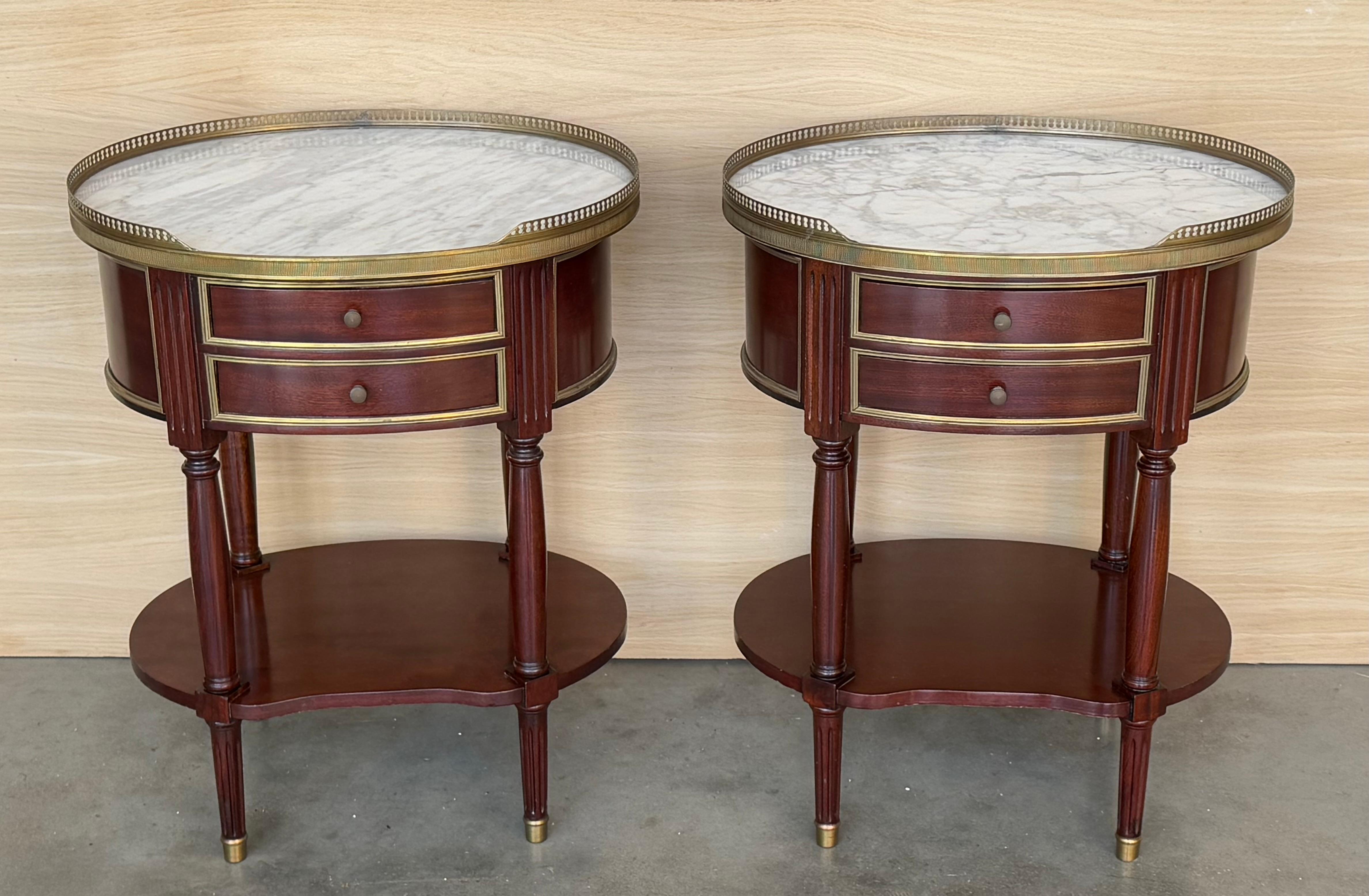 A French Louis XVI style neoclassical nightstand, with a pierced brass gallery and Bianco Carrara marble top, two drawers and lower shelf. Perfect as an end table too!

Height from the floor to the low shelve : 7.48 in