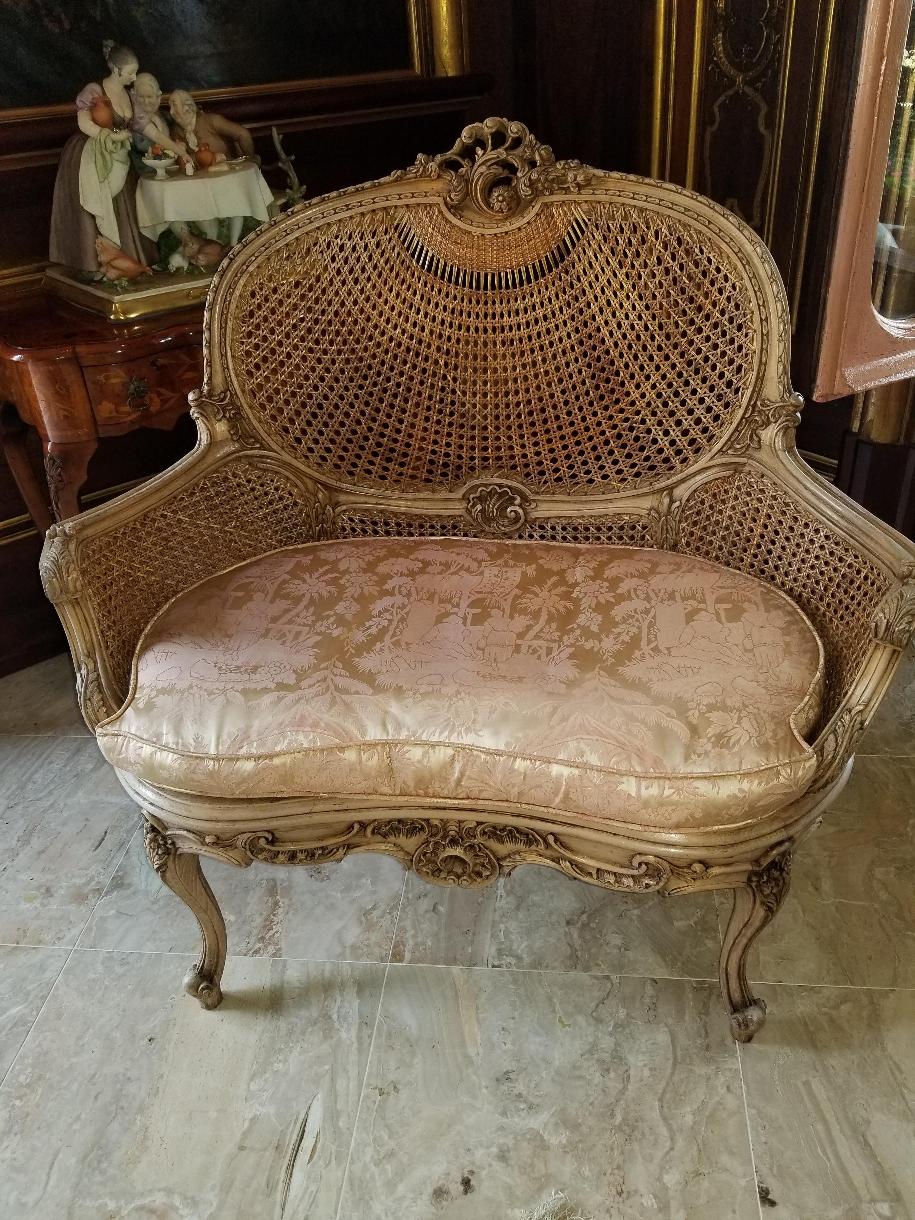 20th century pair of Louis XV natural wood settee with caning back and seat. Sides have double caning.  Fabric needs to be replaced
 