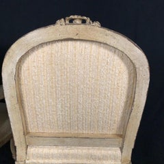Pair of Louis XV Neoclassical Style Cream Painted French Bergere Arm Chairs