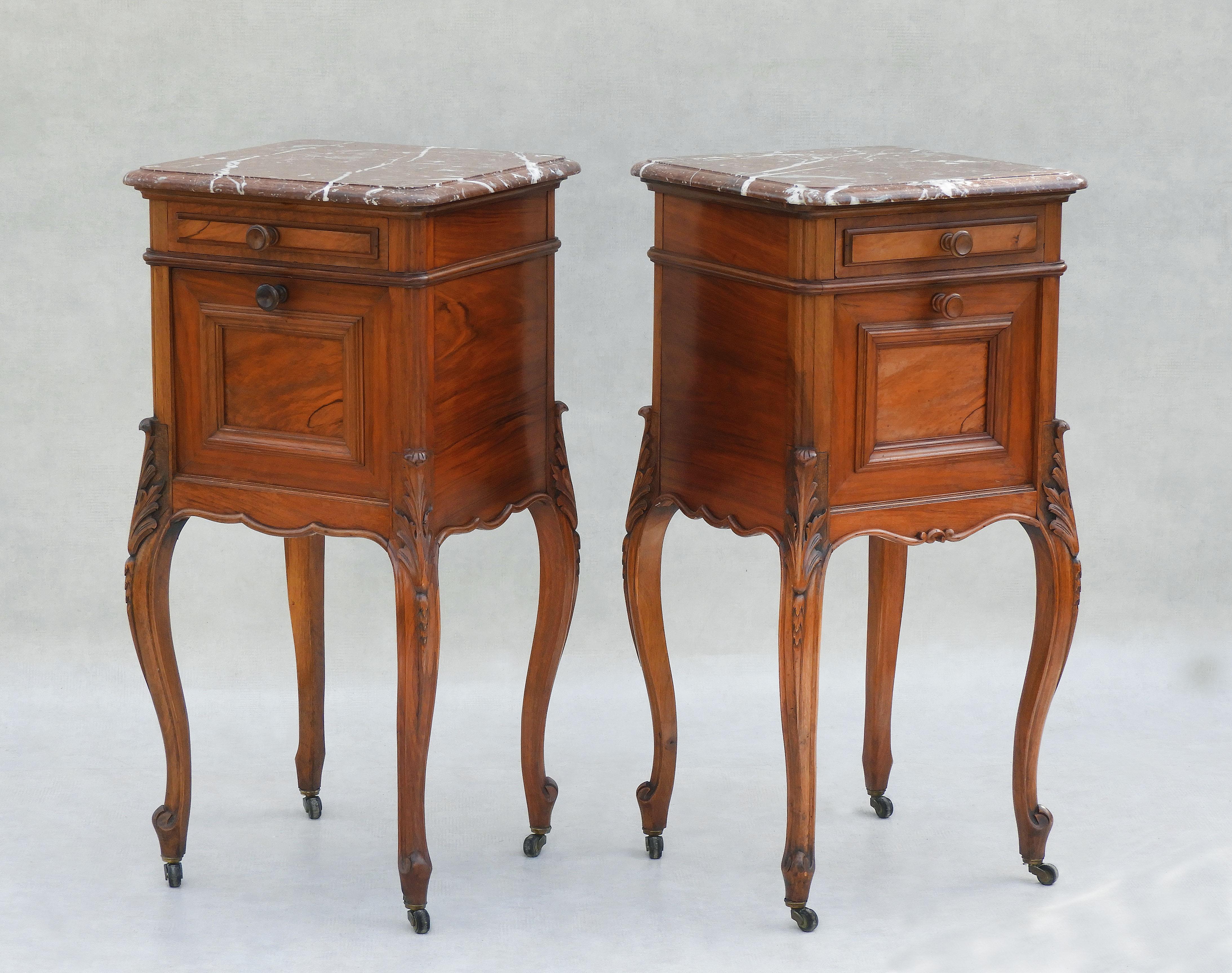 A great pair of Louis xv style bedside tables or nightstands from 19th-century France. Two stylish cabinets each with a drawer and cupboard. Tall, generously proportioned with an attractive variegated marble top, beautifully carved cabriolet legs