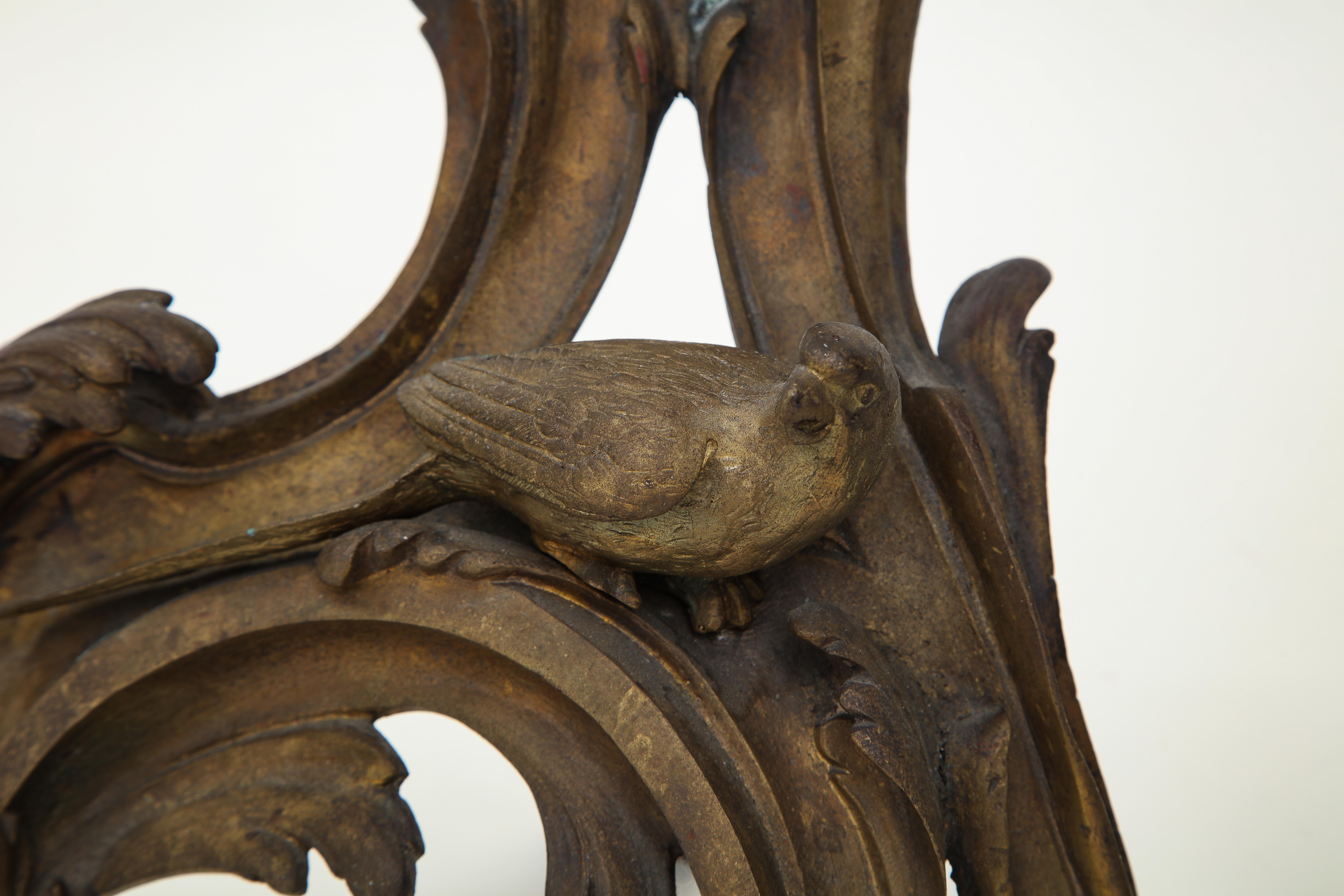 Each sculpted with a bird perched on foliate C-scrolls.

Provenance: The estate of Samuel P. Reed.