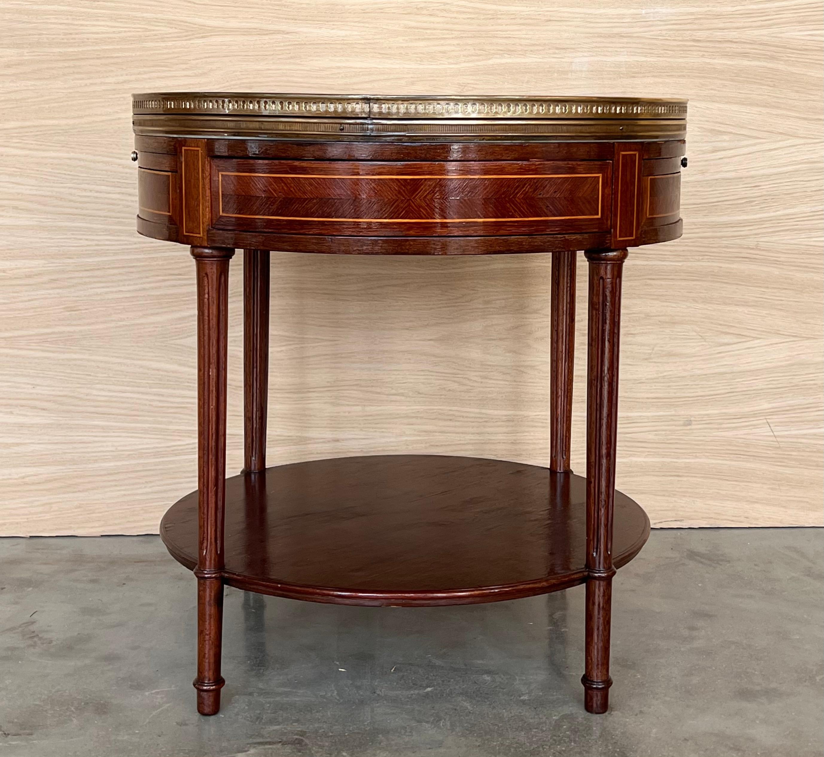 A French Louis XVI style neoclassical nightstand, with a pierced brass gallery and Bianco Carrara marble top, pull-out both trays, single hidden drawer and lower shelf. Perfect as an end table too!

Height from the floor to the low shelve : 5-9in