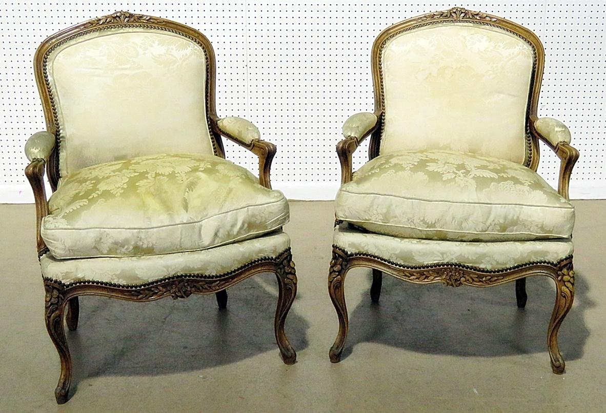 Pair of Louis XV style armchairs with nailhead trim.